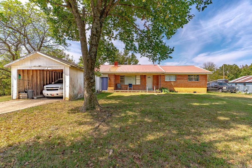 Welcome to market 19571 Highway 90 of Ravenden Springs, Arkansas! This home has a spectacular view of the rolling hills, pastures, trees and more!  Setting on 13 acres +/- this home provides 4 spacious bedrooms, a nice living room that flows into the dining room, a large kitchen, a laundry room, and an extra area that has many possibilities. The living room has a wood burning fireplace with built-ins around it. There are 4 exterior buildings, 3 difference fenced in areas, a pond, and a carport.  New furnace was installed in 2023. Call today to schedule a tour of this unique property!