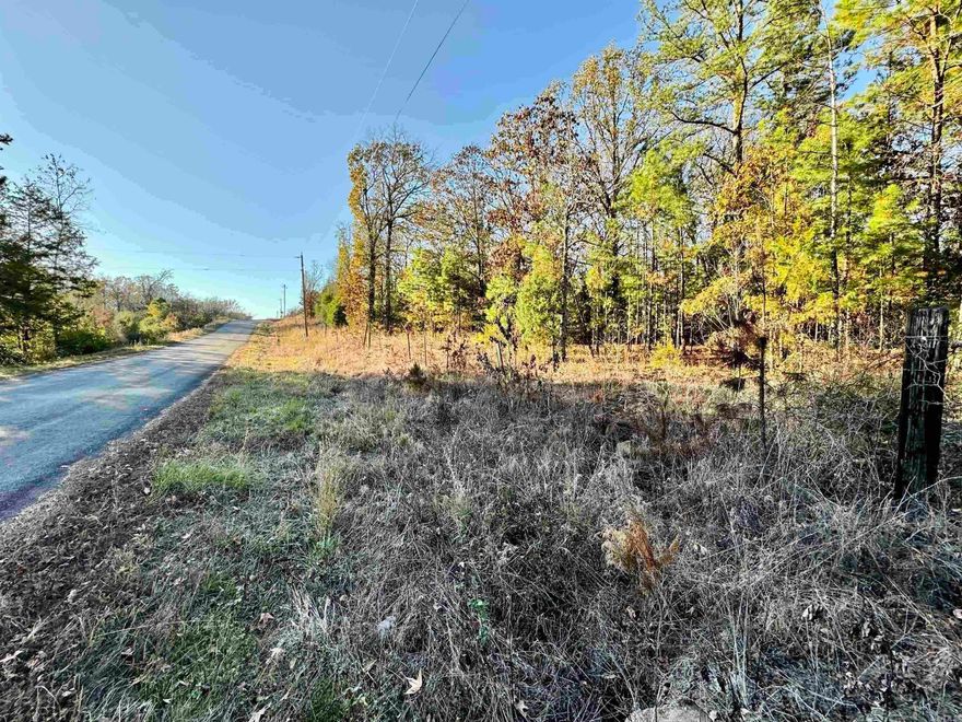 Gorgeous 7.70 acre tract that sits on a corner lot. You can get to this property from 3 different roads. All the roads are paved.There are utilities available at street. Perfect for a wonderful home setting. Mobile homes are allowed. Property already fenced with Barb wire all the way around it. There is a gate and dirt driveway onto property. This property is a must see!
