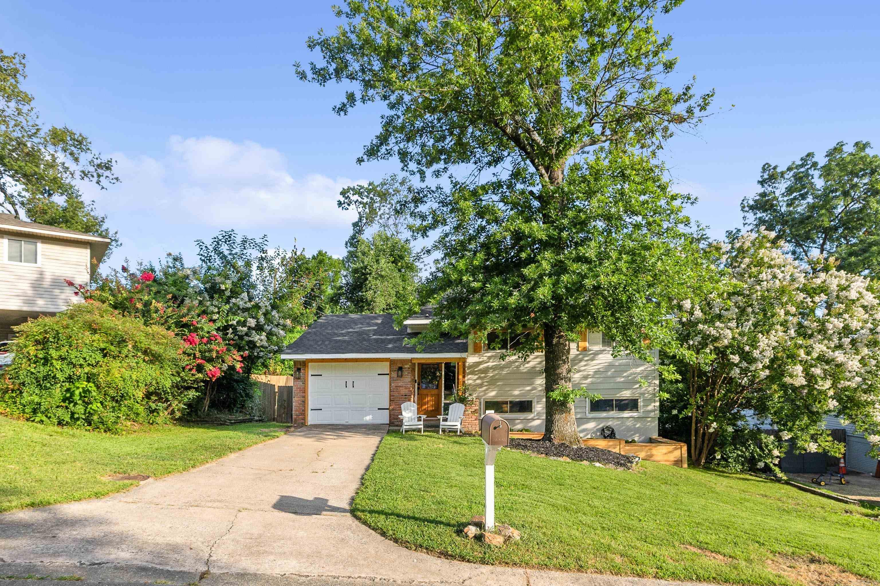 Welcome Home! This adorable split level home has been heavily refinished! The kitchen has new cabinets/butcher block counters/backsplash/appliances/wine cooler & island! Refrigerator stays with acceptable offer. Both bathrooms & laundry have been remodeled Washer/Dryer stays. Other updates include new flooring down, doors, recessed lighting, fresh paint, updated hardware & fixtures throughout. Barn doors, board & battan, built-ins, fireplace & crown moulding have been added. Lots of "new" outside too! Cute curb appeal with new cedar accents and planter boxes. Enjoy the very private backyard with a fantastic new deck, new sod, and the addition of a firepit all within the new cedar fence. Roof 2023. Schedule your tour today!