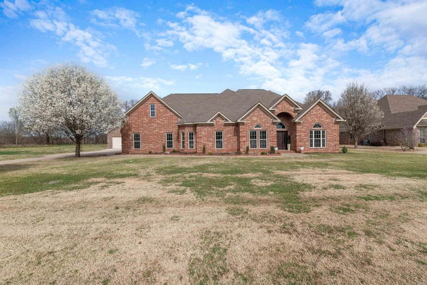 Gorgeous Executive home thoughtfully situated on a stunning 1.10 acre lot within a gated community is waiting for you! This incredible 4 Bedroom, 2.5 bathroom home has plenty of space for everyone! On the main level, enjoy the open floor plan with split bedrooms. 2 generous sized bedrooms together with a bathroom to service, is located on the right of the home - while the Primary Suite is tucked away for privacy and seclusion! The kitchen - with double ovens & gas cooktop - boasts tons of natural light, sure to brighten your mornings! The palatial living room with fireplace creates an atmosphere perfect for entertaining! Upstairs you will find the MASSIVE fourth bedroom with private half bathroom and additionally a FANTASTIC theatre room that could be used as a game room! The patio on the back of the home leads you to an area where you can enjoy beautiful sunrises and sunsets!. But the best part of the backyard is the FABULOUS INGROUND POOL! It is the PERFECT place for a backyard BASH! Also, enjoy the additional 3 car detached garage that has an unfinished space just waiting for you to make it your own! This home has so much to offer as you leave the hustle and bustle of the city!