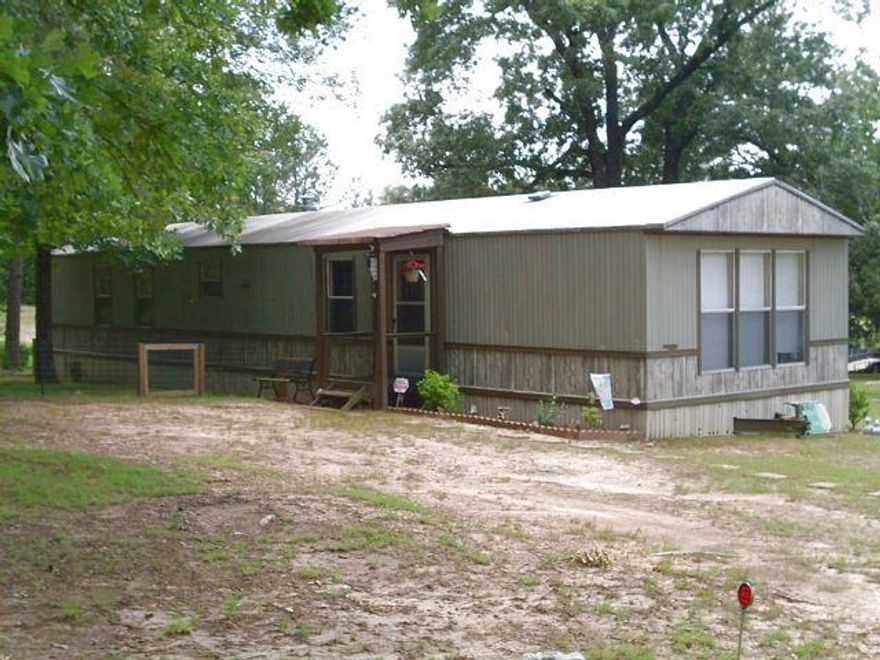 16 x 70 Manufactured Home.  Storage building.  1.64 acre lot.  Partially fenced.  Great rental potential.