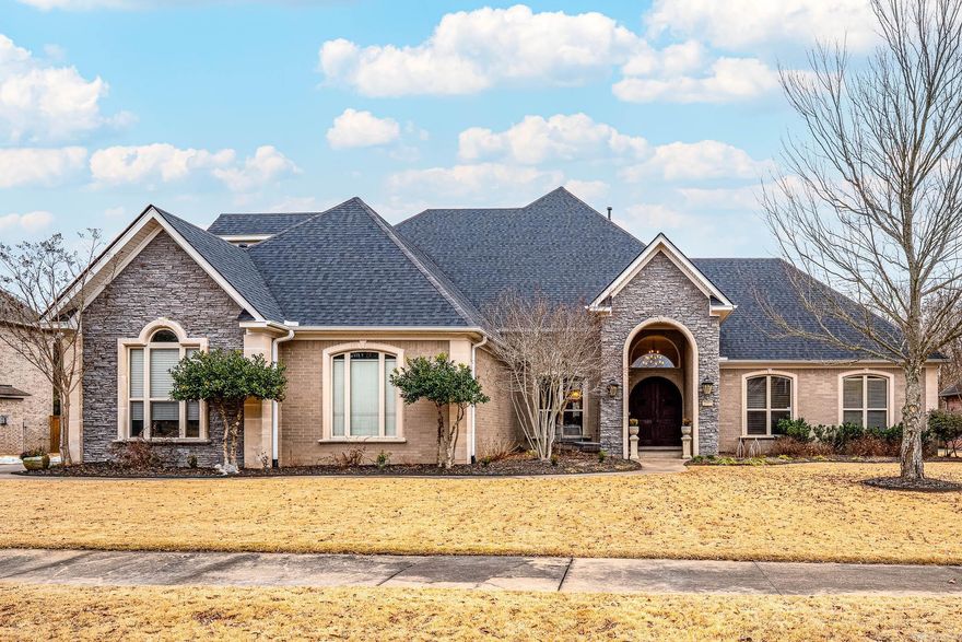 Exquisite 4-bedroom, 4.5-bathroom home situated in the highly desirable West Little Rock neighborhood, The Ranch. As you approach the home, you're greeted by a set of round arch double doors. Step inside to a soaring foyer and an elegant formal dining room. The main level features the spacious primary bedroom, a guest bedroom with an ensuite bath, a dedicated office, and the laundry room. The primary bath is a true retreat, boasting a double-head walk-in shower and a luxurious jacuzzi tub. The kitchen seamlessly connects to a cozy coffee bar, a charming breakfast nook, and a large living room with a fireplace and soaring 21-foot ceilings that fill the space with natural light. Upstairs, you'll find a gym, another guest bedroom with an ensuite bath, and a fourth bedroom with a private bathroom and bonus room, complete with its own kitchenette. The expansive, flat backyard is perfect for outdoor living, featuring a covered patio and raised garden beds. The Ranch offers residents a variety of amenities, including a nature preserve, playground, and private boat ramp. With so many exceptional features and details, a showing is the best way to truly appreciate all this home has to offer!
