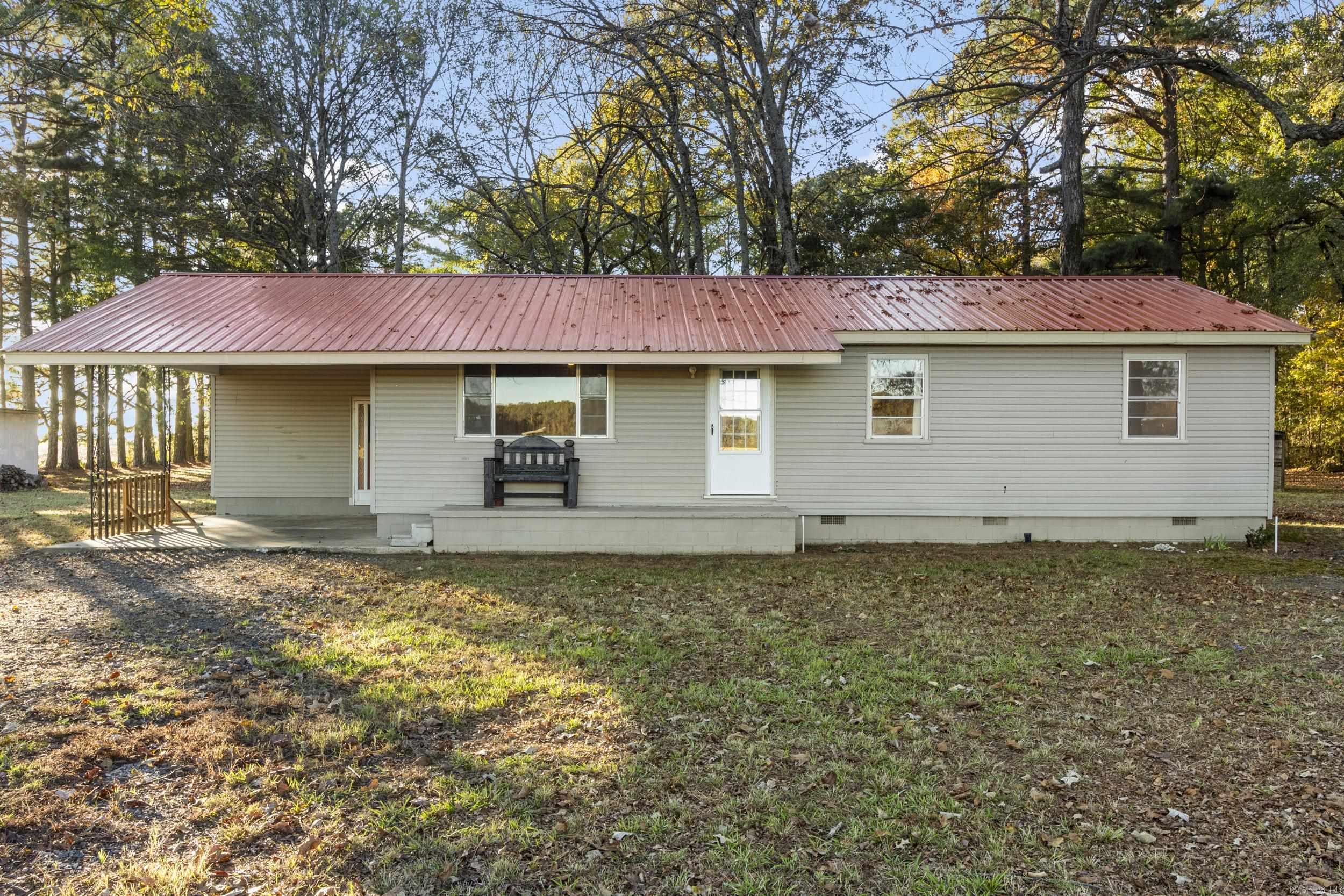 Escape to 2 serene acres of countryside, where this cozy retreat offers a private haven for outdoor enthusiasts and hunters alike. Tucked away from the city, this property is ideal for those who value seclusion, natural beauty, and room to roam. Step into this welcoming home, featuring practical living spaces and a functional kitchen. Outside, the land shines with open space, multiple outbuildings, and a storm shelter, offering ample storage for hunting gear, decoys, and outdoor equipment. Brand New Deck on the back! Picture yourself sipping coffee on the porch as the sun rises or gearing up for a successful day in the duck blind. The backyard is perfect for family moments, whether the kids are playing in the wide-open spaces or youāre swapping stories by a fire. Despite its tranquil setting, this property keeps you close to essentials, just 15-20 minutes from town. Itās the perfect mix of peaceful retreat and convenient access. Square footage approximate, please measure.