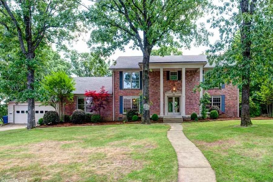 Stately Colonial sitting on ¾ acre with decking across the entire back looking out on 40+ acres of woods.  Gorgeous remodeled kitchen/greatroom opening to screened porch.  Main level master suite has remodeled spa bath, huge closets, fireplace, breakfast bar, and French doors leading outside.  Also on the main level are formal and informal dining areas, office/study, and separate living space with fireplace and wall of windows.  5 large bedrooms & 3 baths upstairs.  Don’t miss the workshop under the house.