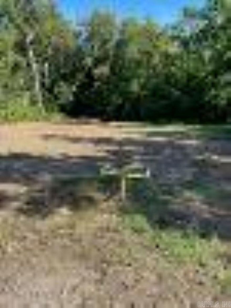 An acre lot to put a mobile home on or build on. Water, electric, gas, & septic are already on the property. Also, there is a storm cellar on the property. No survey on file.