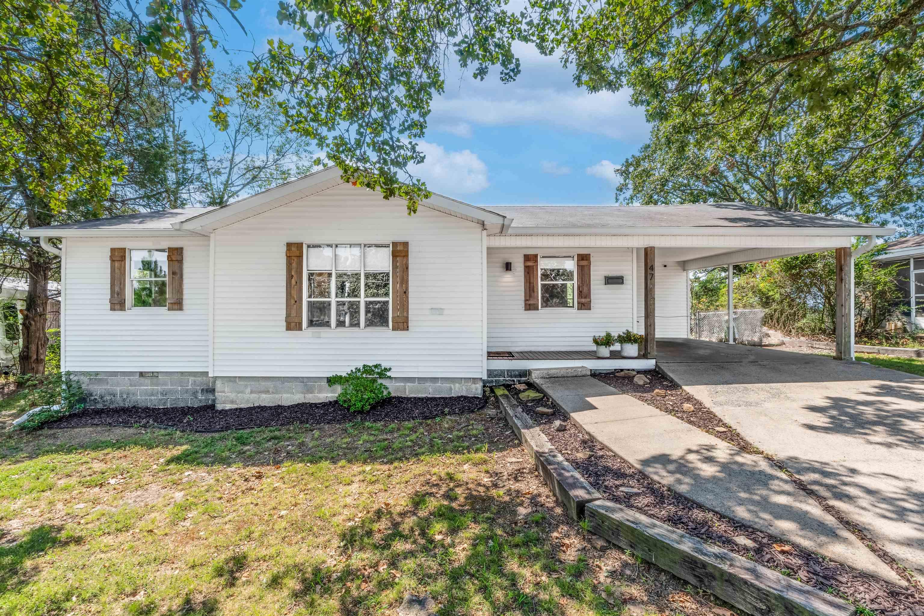 What a cute house on such an iconic street in North Little Rock. Situated just outside Camp Robinson base, this move-in ready home on Sunset Drive will wow you with its updates, great lot and charm. Kitchen has had a recent remodel (2023) with new appliances and cabinetry boasting pull out shelving on the lowers and soft-hinge closing. Cooks will love the gas stove. Luxury vinyl flooring throughout and an updated bath with subway tile surround complete this home. Step outside and enjoy your covered porch and large back yard - lots of privacy back here. Hurry- at this price point and with this charm - shouldn't last long.