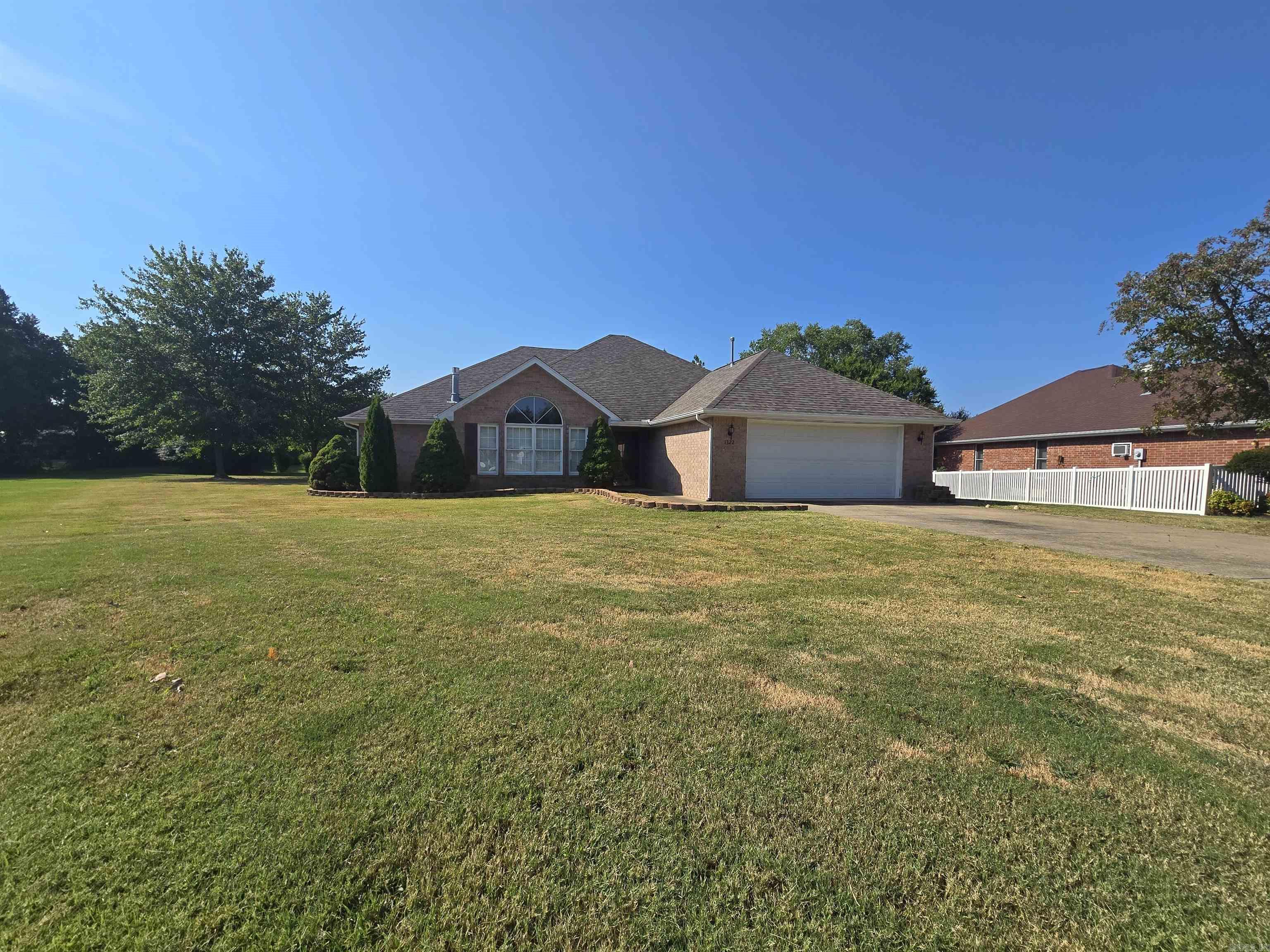 Peaceful living meets everyday convenience in this Chestnut Hills home! Tucked at the end of a quiet cul-de-sac, this all-brick, single-level beauty offers 3 bedrooms, 2 baths, and a smart split-bedroom design. The spacious primary suite includes a relaxing jetted tub, walk-in shower, and oversized closet. A bright kitchen with granite countertops and maple cabinetry opens to generous dining and living spaces with vaulted ceilings and a cozy gas-log fireplace. Sunlight fills the heated and cooled sunroom, perfect for morning coffee or quiet evenings, while the back patio overlooks a beautifully landscaped yard with flowering trees and perennials. A 2-car garage provides convenience and storage, and gutters with leaf guards help make upkeep simple. Thoughtfully cared for and move-in ready, this property is just minutes from shopping, dining, medical services, and Norfork Lake, blending comfort, charm, and location in one perfect package!sitting on 1/4 AC M/L for $350,000.