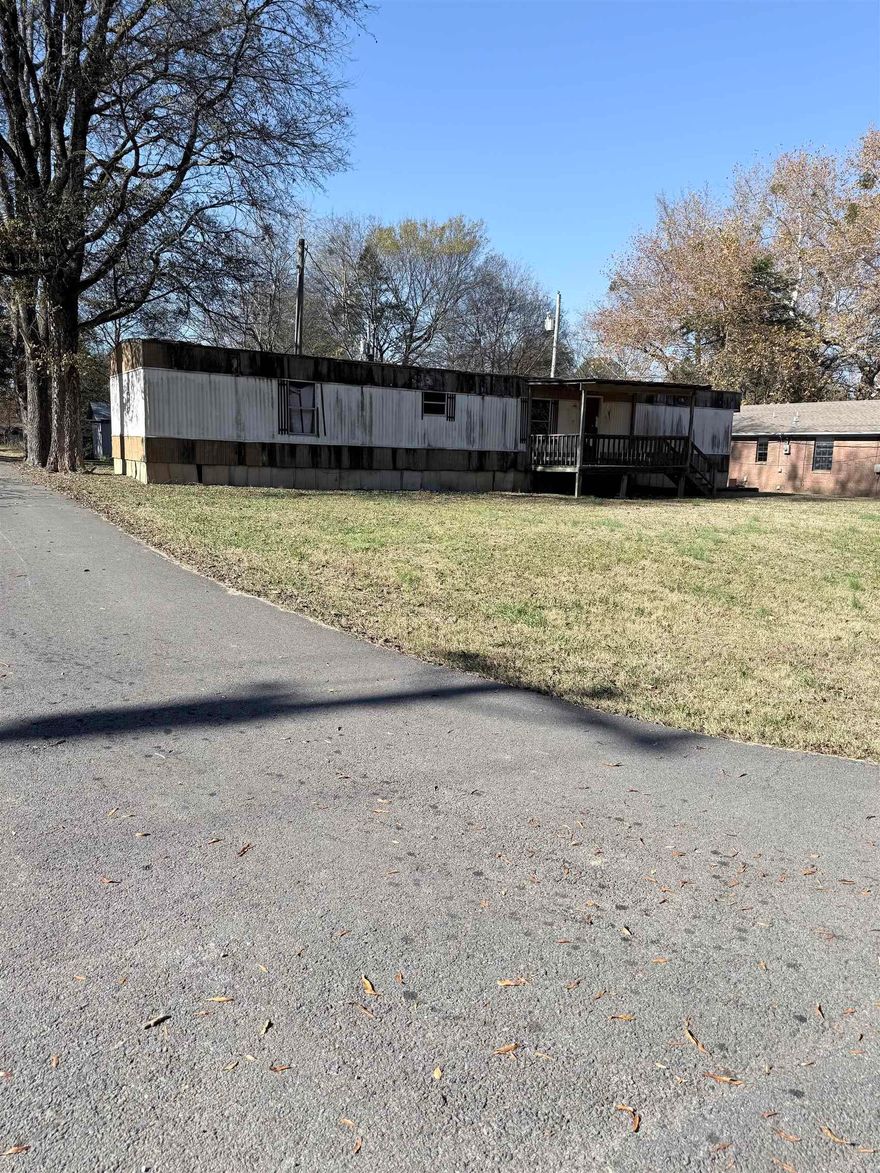 Mobile Home is on Corner Lot with Big Front yard.  Close to AR-10 needs TLC. Sold As Is