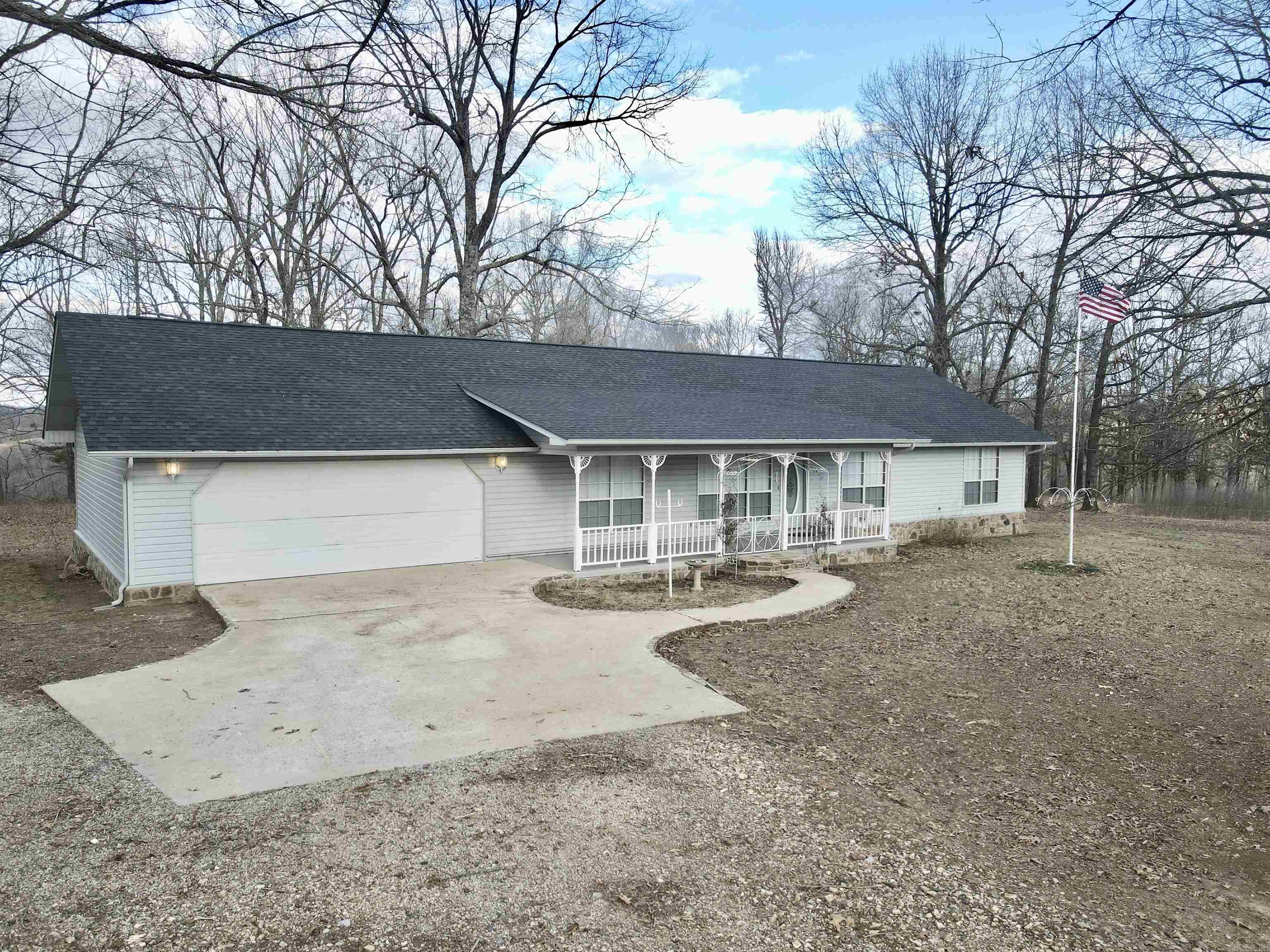 Situated on 12 beautiful acres, this 1,817 sq. ft. home features 3 bedrooms and 2 baths, offering both comfort and recent upgrades. The home boasts a new roof, fresh interior paint, new flooring, and high-speed fiber internet availability, making it move-in ready. The heating and cooling system has been serviced and is in excellent condition. An attached 724 sq. ft. garage adds convenience, while a 720 sq. ft. shop out back provides ample space with a concrete floor, storage, and versatile functionality. The property includes a basketball court, a garden area, a relaxing outdoor patio, and large oak trees providing abundant shade. Additionally, the home is on a well, ensuring a self-reliant and peaceful lifestyle.