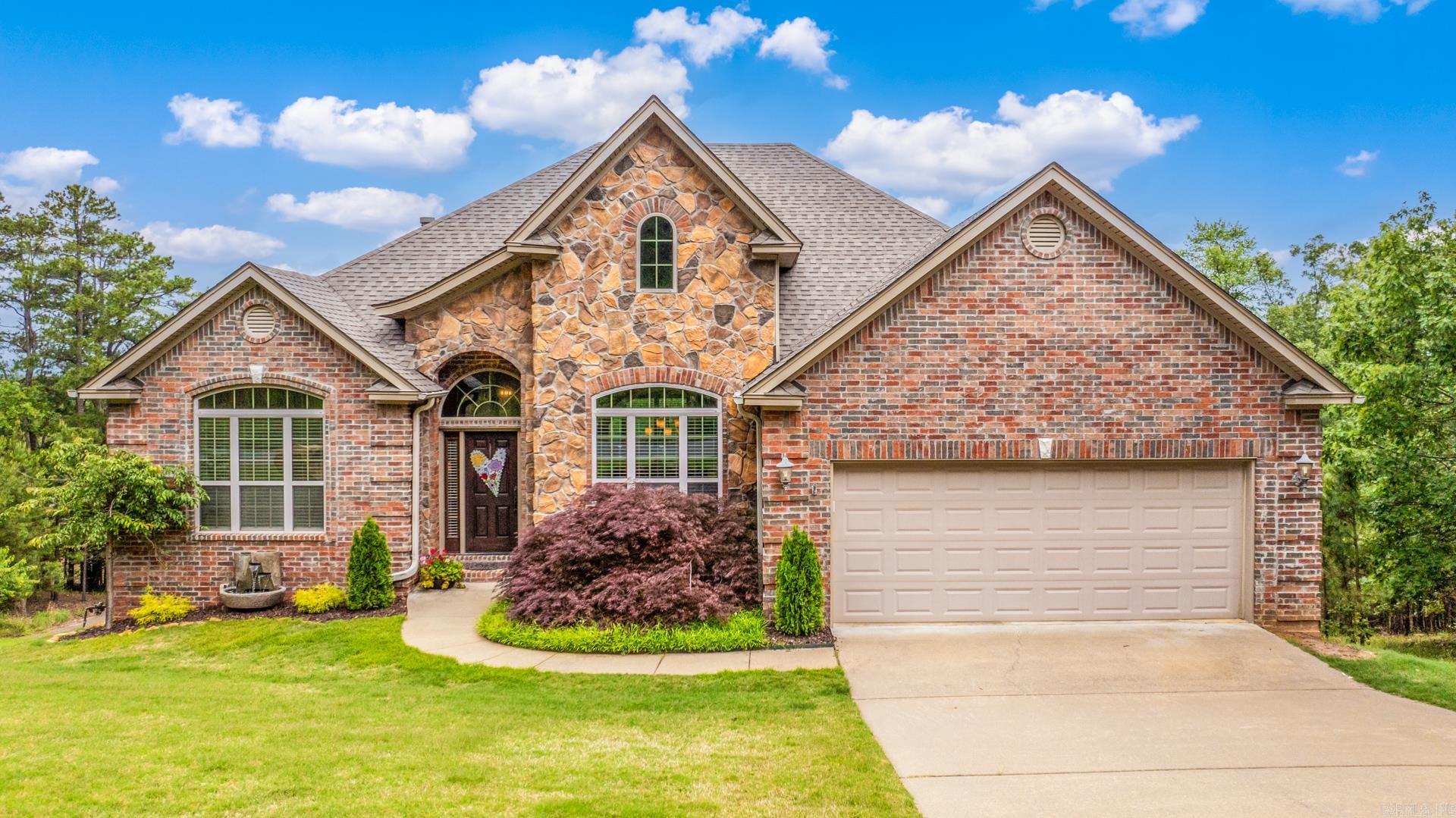 Beautiful one-owner home atop Majestic Point with stunning views! Enjoy an in-ground heated Gunite pool, hot tub, and lush landscaping. Main level features 3 bedrooms (one used as an office), open floor plan, soaring ceilings. The chefs kitchen offers granite countertops, stainless appliances, gas stove and a spacious walk-in pantry. Enjoy extensive crown molding through out the home. The Lower level includes 2 more bedrooms, (one being used as a work out room), beautiful stained concrete floors, a second living area, and a large walk-in safe room. Relax on two decks and watch breathtaking sunsets. A tranquil water feature greets you at the front entry. This home is a rare blend of luxury, function, and beauty!