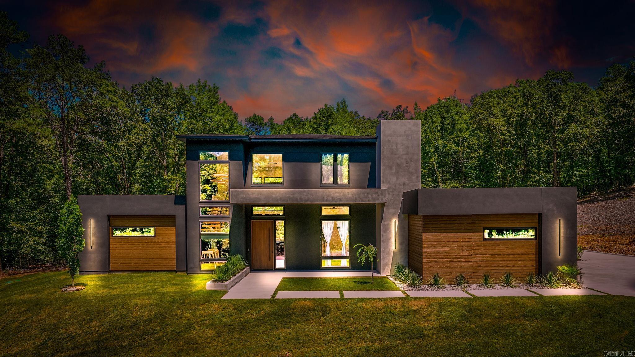 One of a kind hyper-modern 2024 estate nestled on 6.92 acres offers a rare blend of luxury, privacy and style. Conveniently located near Wildwood Park for the Arts, shopping, and dining, this home offers peace and seclusion. Every inch of this property has been meticulously designed with a seamless blend of beauty and functionality. The open floorplan is highlighted by soaring 25 foot ceilings & a striking center spine staircase, setting the tone for the entire home. The kitchen, dining room, & great room effortlessly flow together, with floor-to-ceiling windows that bathe the space in natural lightācreating a welcoming atmosphere for gatherings. The living area includes a Venetian plaster fireplace. The powder room features Versace wallpaper. On the main level, the primary bedroom offers a spa-like bathroom & oversized walk-in closet. A private guest suite with full bath could be 2nd primary bedroom. Office currently serves as a nursery. Upstairs, two additional spacious bedrooms & a beautifully designed hall bath. The covered outdoor patio spaces offer idyllic private wooded views that surround the property. RV parking pad. Quality craftsmanship throughout. Luxury at its best.
