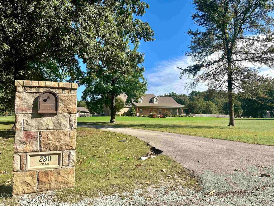 Do you like to sit back, relax and unwind when you come home? This home looks like it was custom built with comfortable, and county living in mind. The wrap around porch also adds to the take a load off feeling.'' Sitting on 3.47 acres, this home gives you lots of breathing room to spread out, tinker in the 30 x 40 ft shop or read the  afternoon away in the she-shed. Despite the large square footage,the spaces feel homey. Several family living rooms and/or great entertaining spots make Thanksgiving, Christmas or a summer get  together easy. There's an upstairs bonus room, a living, dining area right off the kitchen, and a glassed in, heated and cooled porch with  a cozy fireplace that overlooks the fenced in huge back yard. Four bedrooms, 4 1/2 baths give you plenty of room for guests or family members. Two downstair bedrooms have attached baths. If teens  are included, the upstairs bonus room can be a great 4th bedroom or hang out spot. It has a huge closet and its own bath. If you work from  home, there is a spacious office complete with built ins. There is also tons or storage!