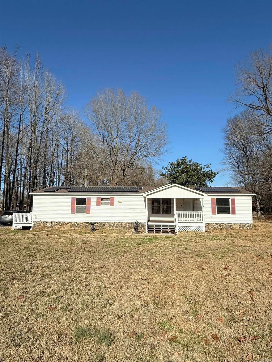 Clean, move in ready home nestled on 3.32 acres! Featuring 3 spacious bedrooms and 2 full baths. This home offers the perfect balance of privacy and convenience just outside city limits, yet minutes from town. Thoughtfully updated with new paint throughout, new flooring in all bedrooms, new light fixtures and so much more! Brand-new stainless-steel appliances that convey. Updated primary bath with dual vanities and walk in double shower. Covered front and back deck for entertaining! Barn on property has electric. Solar will be paid off at closing. *AGENTS PLEASE SEE REMARKS*