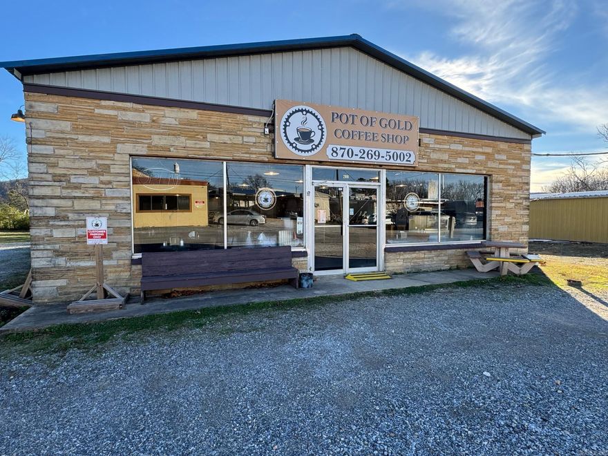 Prime commercial opportunity just off the Downtown Square! This 3,200 sq ft property offers incredible versatility with 2,200 sq ft of restaurant space and a 1,000 sq ft fully remodeled 2-bedroom apartment—perfect for an owner’s quarters, nightly rental, or long-term rental.  The restaurant features 12 dedicated parking spots, 66-person seating capacity, and a built-in stage, making it ideal for live music, coffeehouse events, or full-service dining. It has been operating as a coffee shop/restaurant and is ready for your vision, whether food service, entertainment, or another business concept.  The apartment in the back is beautifully updated and offers private, modern living space or an additional income stream.  Located right off the Downtown Square, this property offers excellent visibility, steady foot traffic, and unmatched convenience. A rare opportunity for investors or owner-operators looking for a turnkey commercial setup in the heart of town.