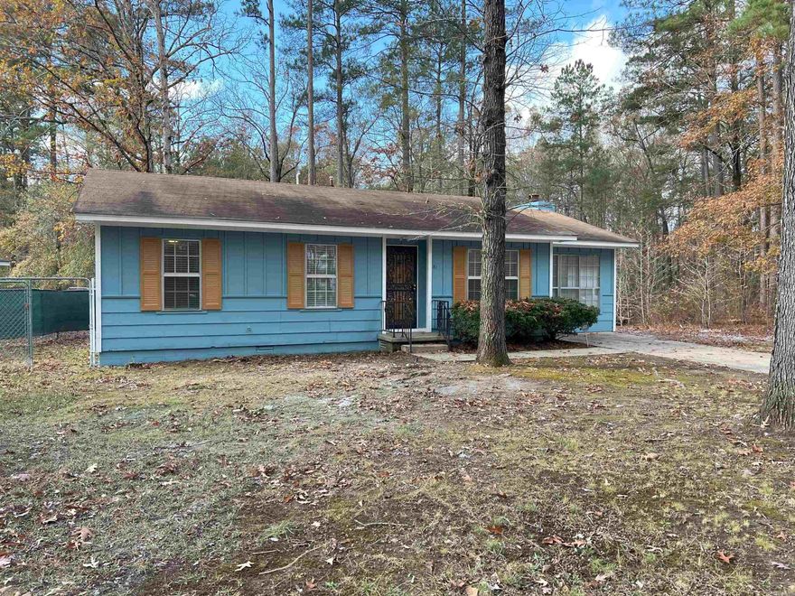 Country setting with convenience.  You could be sitting on your back patio watching the abundant wildlife very soon!  This property is the last house on the street in this neighborhood, surrounded by trees and is peacefully private.  This home features 4 bedrooms, 2 full bathrooms, a wood burning fireplace, partially fenced yard, storage building... and did we say privacy?  FULLY REMODELED with updated EVERYTHING!