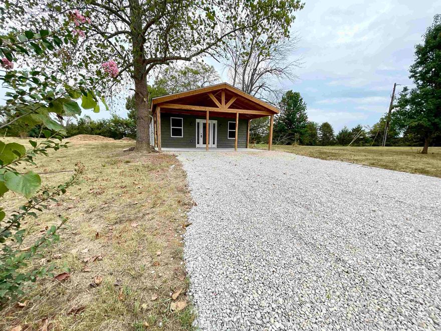 Charming 2-Bed, 2-Bath Freshly Remodeled Country Home on 2.19 Unrestricted Acres – Fulton County, in North Central AR! This stunning property blends modern upgrades with rustic charm, offering comfort, style, and plenty of space to enjoy the great outdoors. This home has been completely updated from top to bottom. Recent improvements include Shaker style siding, new doors, floor joist, new windows, new bathroom vanities, faucets, arch shingles, front porch with cedar beams, gutters, wiring, lighting fixtures and plumbing, giving you the confidence of a move-in ready home. A new 3 ton Heil heat pump provides energy-efficient heating and cooling, and a new septic system with lateral lines ensures peace of mind. Step inside to find a warm and inviting interior featuring vinyl plank flooring, hardwood accents, and quartz countertops in a stylish kitchen complete with stainless steel appliances and a Marathon hot water heater. Outside, the landscaped yard is filled with walnut trees, oak, elm, maple, and vibrant crepe myrtles, creating a serene, park-like setting. With county water, no restrictions.