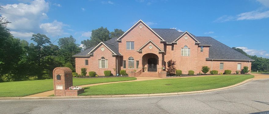 Absolutely a beautiful home with many improvements  within the past three years. This house was sold before it was listed. Open floor plan on mail lever with double doors leading to a covered porch with steps leading to a rocked patio with brick lined wall surrounded by several flower beds and shrubbery. Nice master broom with updated master bath to die for. Additional broom on this lever with its own bath. Another neat feature on the main level is the indoor swimming pool. Enjoy it year round. Watch it snow in the winter. Watch the golfers burn up on those hot days. Your family and friend are sure to have fun year round. Upstairs are three more brooms, two having their own bath, a very large family room with a balcony also to enjoy watching golfers go by. Walkout basement features an overhead "golf cart" door to drive into. It can be divided off. This area if finished/heated and cooled. Use it for storage, hobby room, exercise room  or kids play room, you decide.