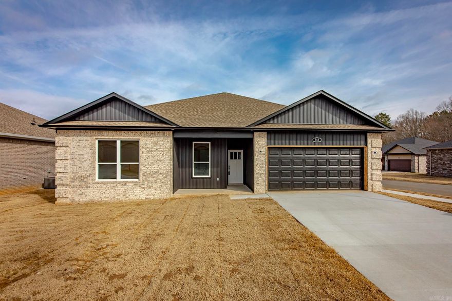 Welcome to this stunning new construction home that perfectly blends modern design with everyday comfort. Featuring 3 spacious. bedrooms & 2 full baths, this thoughtfully designed split floor plan offers both privacy & functionality. Step inside to an inviting open-concept layout, ideal for entertaining & daily living. The living room showcases a beautiful vaulted ceiling with a striking stained beam. Luxury vinyl flooring throughout the home, complemented by gorgeous granite countertops in the kitchen & baths. Retreat to the primary suite where you'll find a beautifully designed walk-in tiled shower. Situated on a desirable corner lot within a gated community, this home features also covered patio for relaxing and a 2 car garage. With generously sized rooms & high-end finishes throughout, this home offers the perfect combination of style, comfort, and low maintenance living.