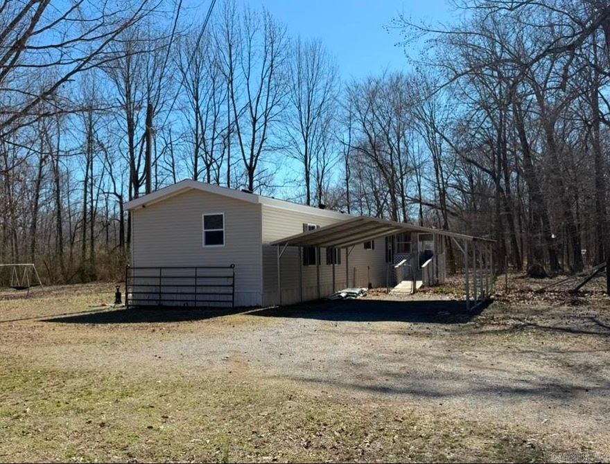 Move-in ready manufactured home on 3.1 acres! This mobile home features an open floor plan with modern kitchen, vinyl flooring, laundry room. Master suite includes garden tub, separate shower, and dual vanities! Outdoors includes carport, multiple outbuildings, and a concrete slab on the back of the property. Water, septic, and electric hookups for RV/Camper next to home as well.