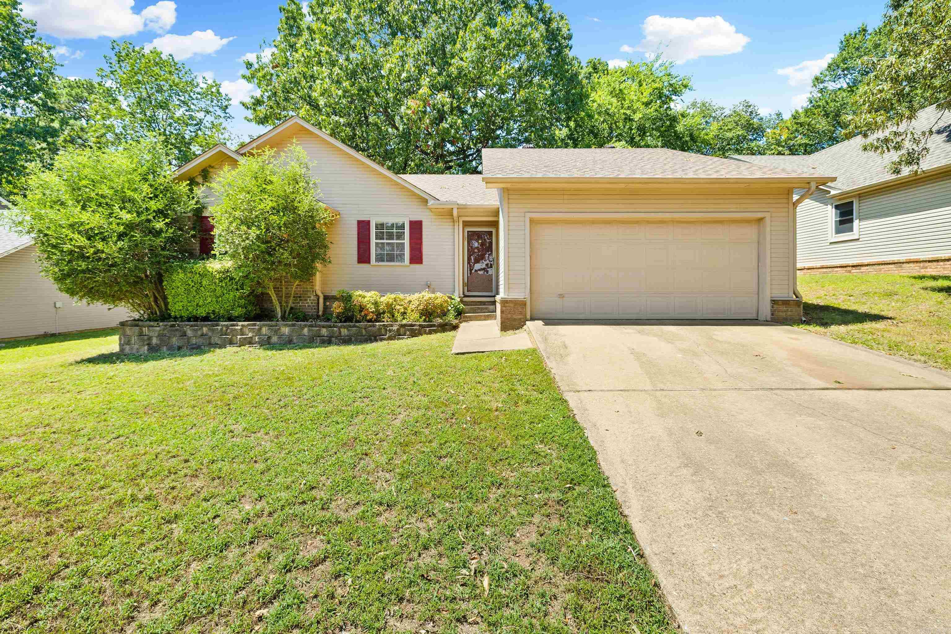 This move-in ready 3 bedroom, 2 bathroom home in the Benton School District offers 1,488 square feet of comfortable living space. The living room features a vaulted ceiling and a classic brick fireplace, creating an open yet inviting atmosphere. Easy-care flooring runs throughout with no carpet, making upkeep simple. The kitchen and dining area provide plenty of space for everyday meals or gatherings, while the bedrooms are generously sized for added comfort. Outside, the large fenced backyard and spacious deck are perfect for entertaining or relaxing. Conveniently located near schools, shopping, and dining, this home is a wonderful blend of comfort, functionality, and location.