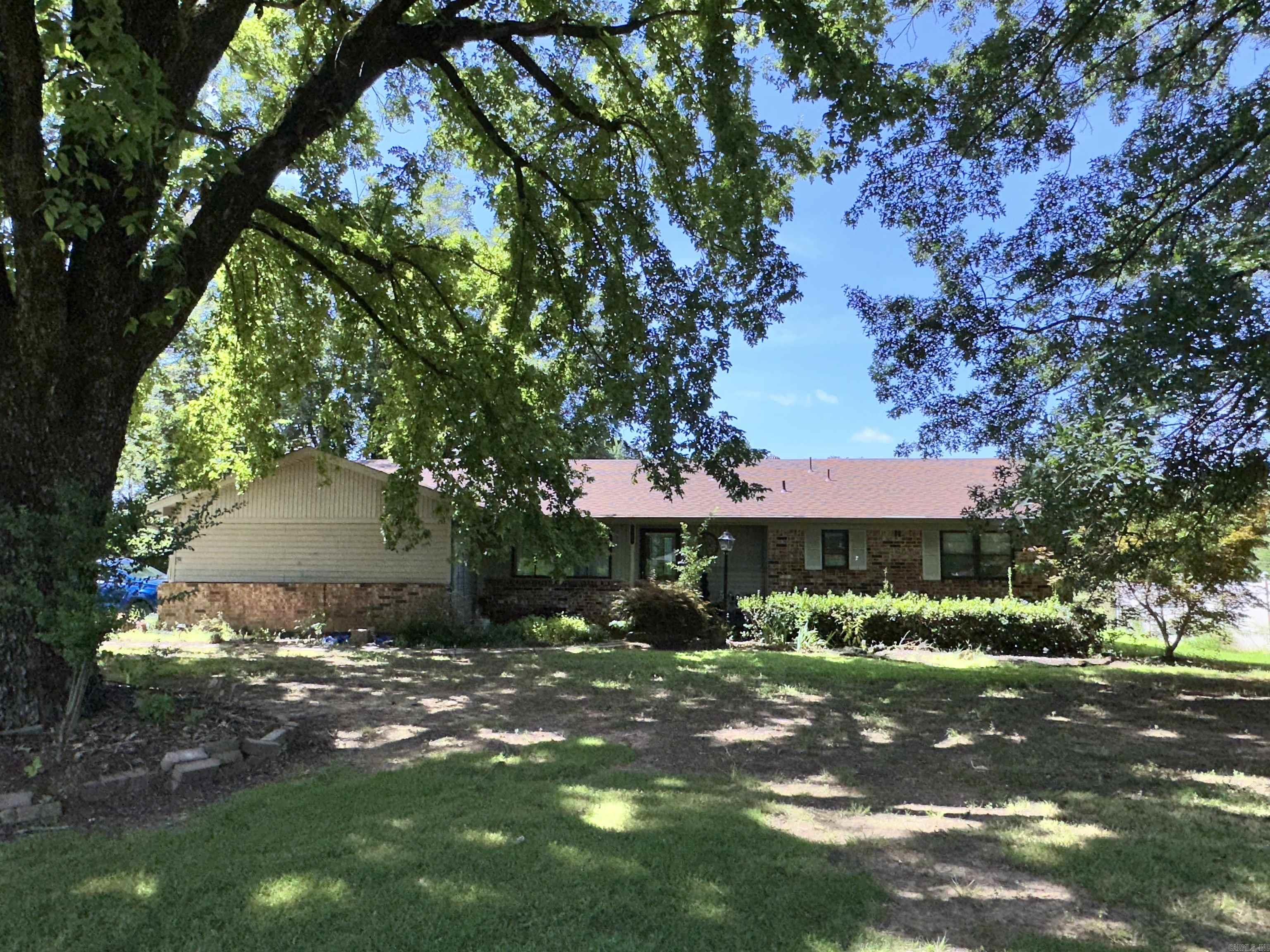 Charming and full of character, this well-maintained home at 2605 W Commercial St offers the perfect blend of comfort, convenience, and small-town charm. Featuring 3 bedrooms and 2 bathrooms, this inviting residence sits on a spacious lot with mature trees and plenty of room for outdoor enjoyment. Inside, you'll find a warm and welcoming living area, a functional kitchen with ample cabinet space, and generously sized bedrooms with natural light throughout. Whether you're a first-time homebuyer, looking to downsize, or seeking an investment opportunity, this home provides endless potential. Located just minutes from downtown Ozark, schools, shopping, and Highway 64, this property is both peaceful and conveniently accessible. Donāt miss the chance to make this charming home your own!