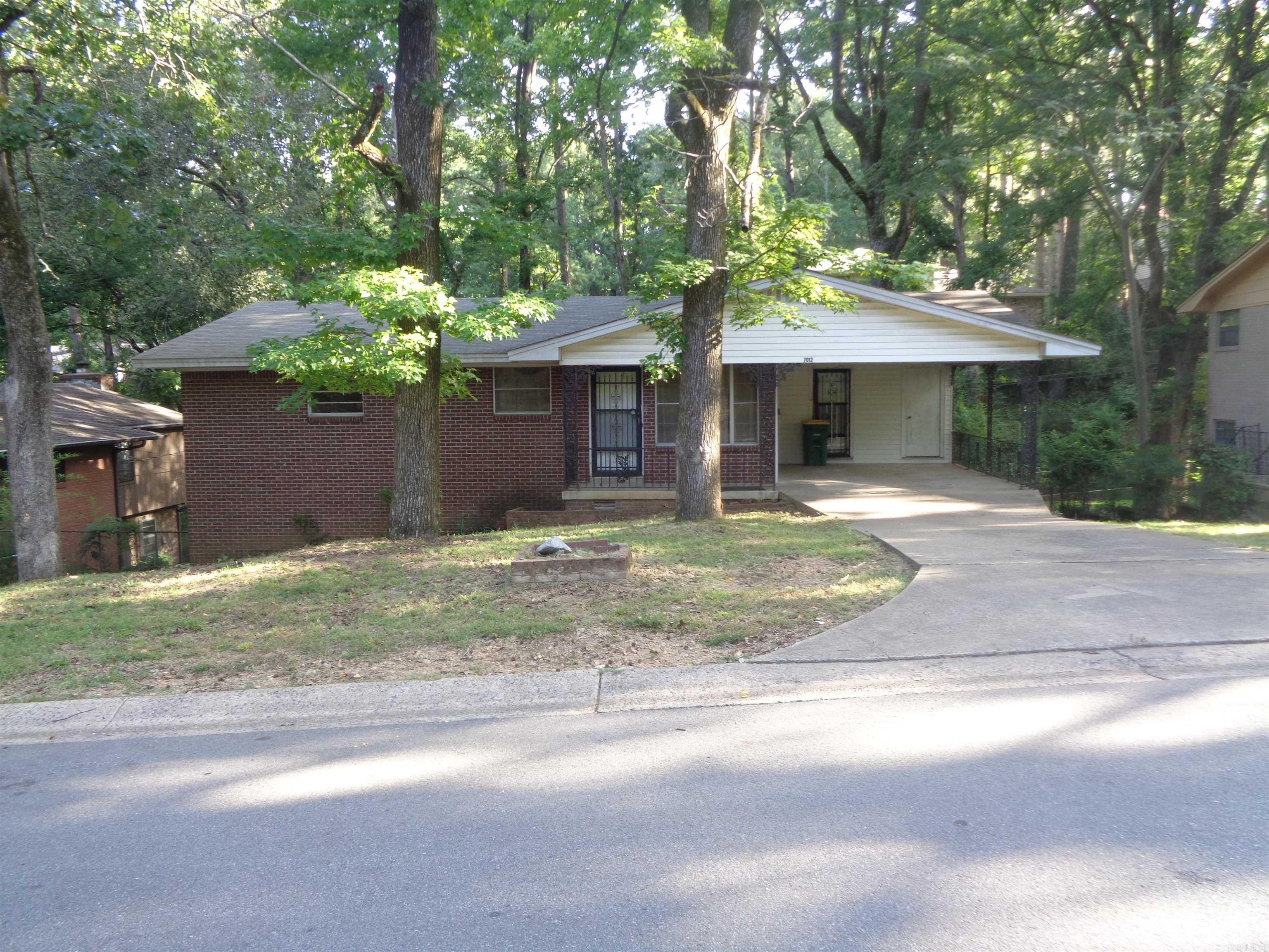 Investment opportunity with this 4 bedrooms, 2 & 1/2 baths all brick house. Some updating is needed and TLC. Lots of storage spaces. Rear yard is wooded. No VA or FHA loans will be considered. There is no seller property disclosure available. There are no utilities on and no termite policy provided. Piano and refrigerator to remain with the property. Property is being sold "AS IS".