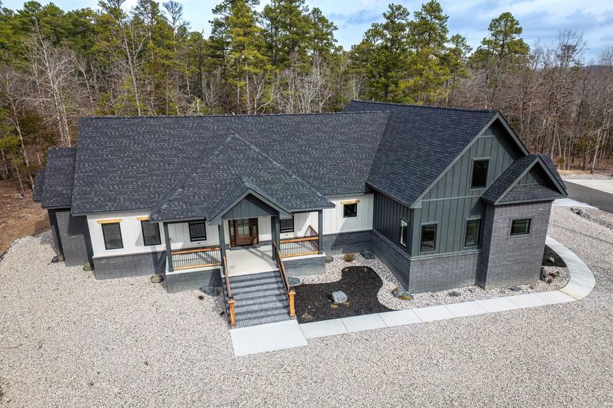 Welcome to your dream home in Hot Springs Village, Arkansas, where luxury meets comfort in this exquisite new construction. This stunning 4-bedroom, 3.5-bathroom residence boasts an inviting open floor concept, offering seamless transitions between living spaces. Step inside and be greeted by the elegance of high-end appliances adorning the gourmet kitchen, complemented by a chic butler's pantry featuring a convenient wine fridge. The heart of the home invites gatherings and culinary adventures, making entertaining a delight. A versatile bonus room awaits your personal touch, perfect for transforming into a cozy media room, a private den, or even a 5th bedroom to accommodate guests or growing families. Indulge in relaxation within the spacious master suite, complete with a lavish master bath featuring a rejuvenating soaking tub and a walk-in shower, offering a serene retreat after a long day. Situated within walking distance from the serene shores of Lake Balboa, outdoor enthusiasts will relish in the proximity to nature's beauty, offering endless opportunities for recreation and relaxation. Experience the epitome of luxury living in Hot Springs Village.