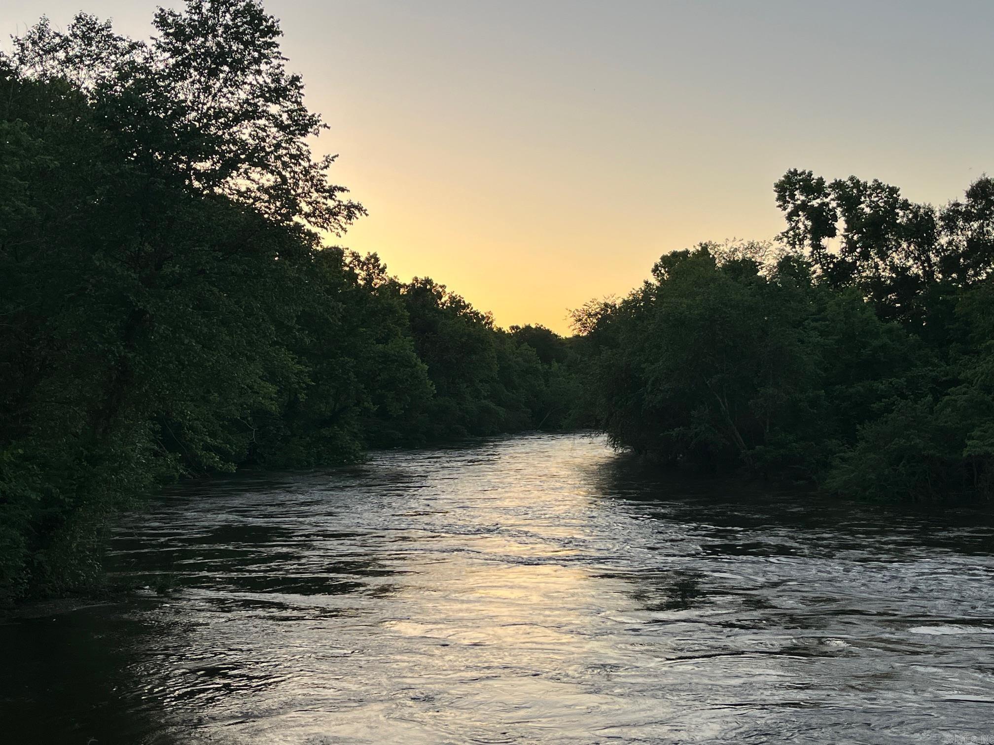 Lot 5 in Caddo Paddock Subdivision has deeded walking access to the Caddo River. Paved county road access along Old Military Road, municipal water, permitted septic, underground electricity, fiber internet, and deed restrictions serve to protect value as well as enjoyment of the property. Restaurants, float outfitters, and I-30 are less than 1 mile away with Arkadelphia being only 5 miles south. The property has a unique history and is ideal for short term rental, AIRBNB, VRBO investment.