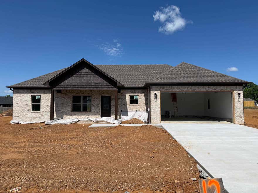Brand-new construction offering modern style and thoughtful design throughout. This single-story home features an open-concept layout with a spacious living area, high ceilings, and abundant natural light. The kitchen includes a large center island, granite countertops, and custom cabinetry.  The primary suite and additional bedrooms are designed for comfort and functionality with contemporary finishes. A covered front porch adds curb appeal and a welcoming touch. Enjoy a seamless flow between living, kitchen, and dining areas, plus plenty of storage and workspace throughout the home. Situated on a generous lot with room to personalize landscaping or outdoor living spaces. Move-in ready soon! Don’t miss the opportunity to own a beautifully crafted new home with quality finishes and modern appeal.