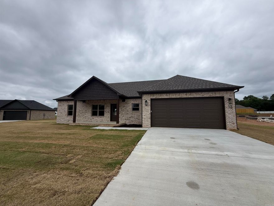 Brand-new construction offering modern style and thoughtful design throughout. This single-story home features an open-concept layout with a spacious living area, high ceilings, and abundant natural light. The kitchen includes a large center island, granite countertops, and custom cabinetry.  The primary suite and additional bedrooms are designed for comfort and functionality with contemporary finishes. A covered front porch adds curb appeal and a welcoming touch. Enjoy a seamless flow between living, kitchen, and dining areas, plus plenty of storage and workspace throughout the home. Situated on a generous lot with room to personalize landscaping or outdoor living spaces. Move-in ready soon! Don’t miss the opportunity to own a beautifully crafted new home with quality finishes and modern appeal.