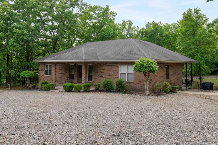 Escape to lake life with this affordable and easy-to-maintain all-brick getaway located just minutes from beautiful Greers Ferry Lake! Whether you are searching for the perfect vacation home, weekend retreat, or investment opportunity, this property checks all the boxes. Designed for comfort and convenience, this spacious home offers 4 bedrooms and 4 private baths, making it ideal for hosting family, friends, or vacation guests. The open kitchen and living area create the perfect gathering space after a day spent boating, fishing, or enjoying the nearby camping and outdoor recreation. Step outside to relax on the covered porch featuring a hot tub — the perfect place to unwind after a fun-filled day at the lake. Additional features include an ice machine, durable all-brick exterior, and low-maintenance living so you can spend more time enjoying the lake life and less time on upkeep.  Offers endless possibilities as a personal retreat, short-term rental, or investment property.  Launch area for your boat or water toys, camp sites or swimming area less than 1/2 mile.  Check it out!