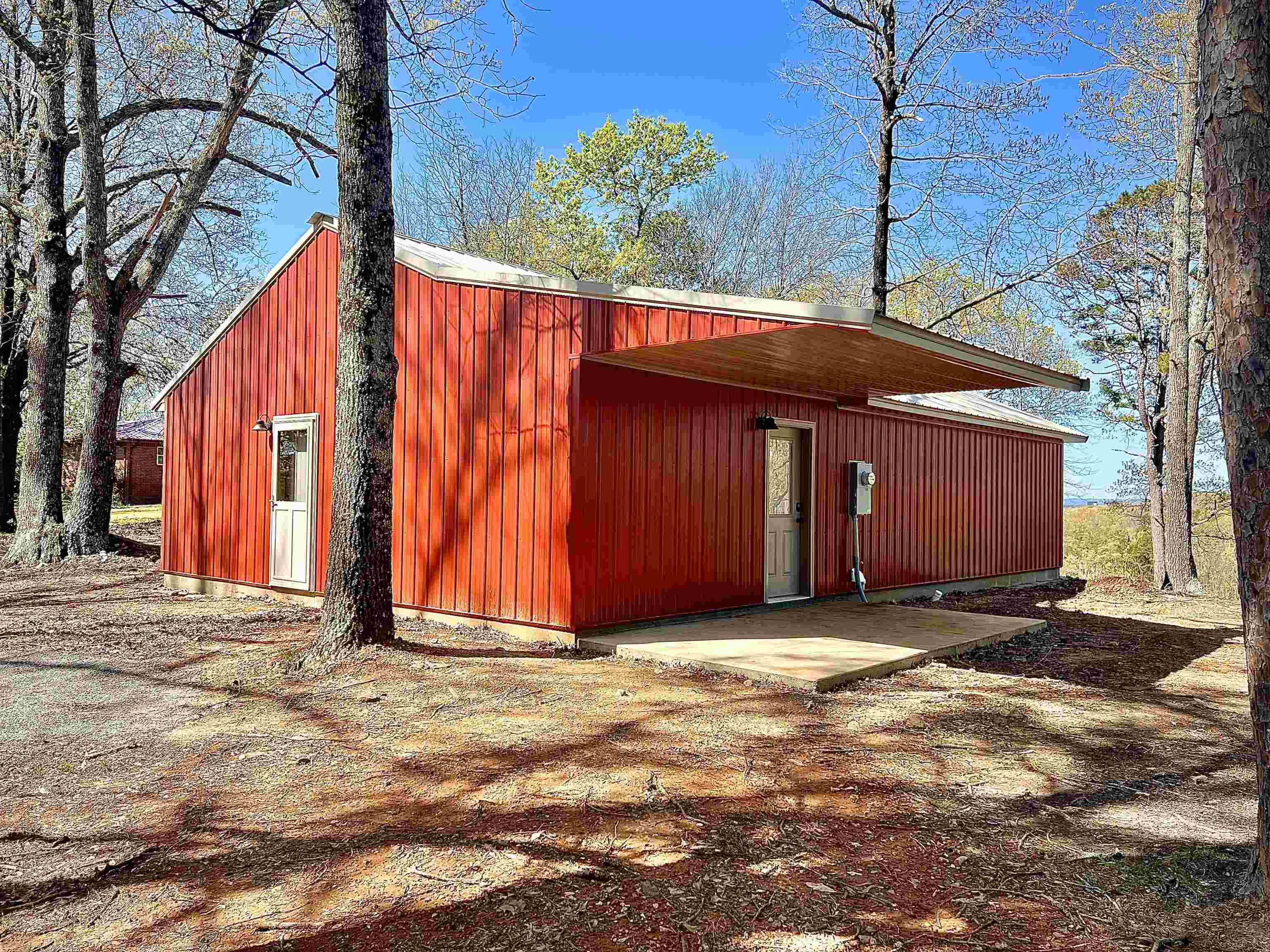 Experience the ideal blend of rustic charm and modern comfort in this brand-new barndominum-style home, set on .67 acres within the city limits. Enjoy the convenience of city water and sewer while surrounded by scenic views and open space. This 3 bedroom, 2 bath home features an open concept living room and kitchen, perfect for entertaining. The kitchen and both bathrooms are outfitted with beautiful custom cabinets, adding style and function throughout. Additional acreage is available for purchase if you're looking to expand your space.