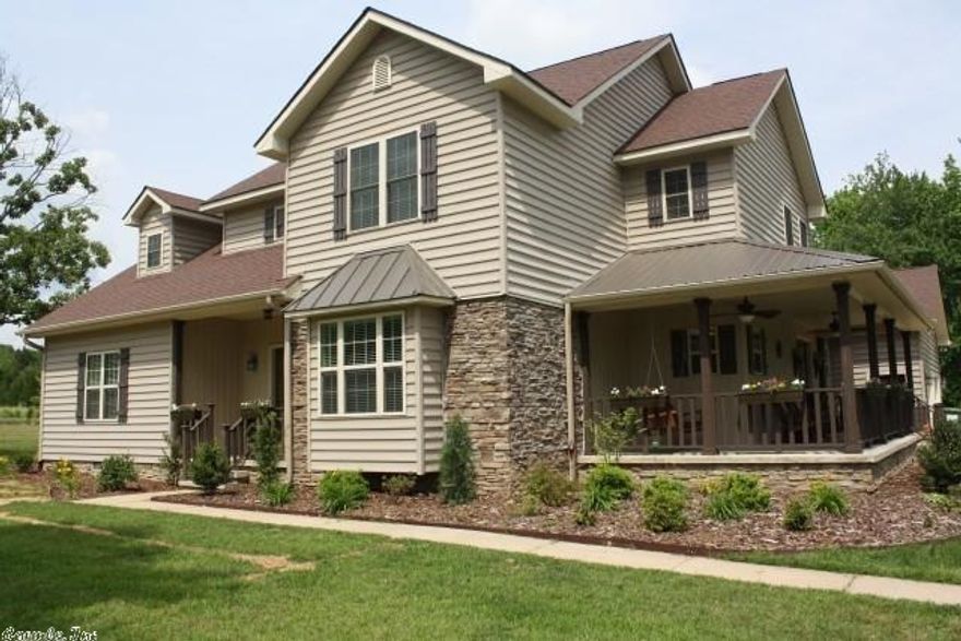 Custom built Craftsman’s style, 1 owner on 3 ACRES. Stacked stone & siding exterior w/ covered porch. Open Living - dining area w/ 10’ ceilings. Wood burning fireplace.  Hand-scraped 5” hardwoods in dining & kitchen. Dark-stained cabinetry w/ swing-out hinged pantry & pull-outs in lower cabinets. Granite counters & stainless appliances. Downstairs master w/ jetted tub & walk-in shower. Double-sided master closet. 3 bed & 2 baths upstairs PLUS office/ sitting room AND a playroom that could be a 5th bedroom.