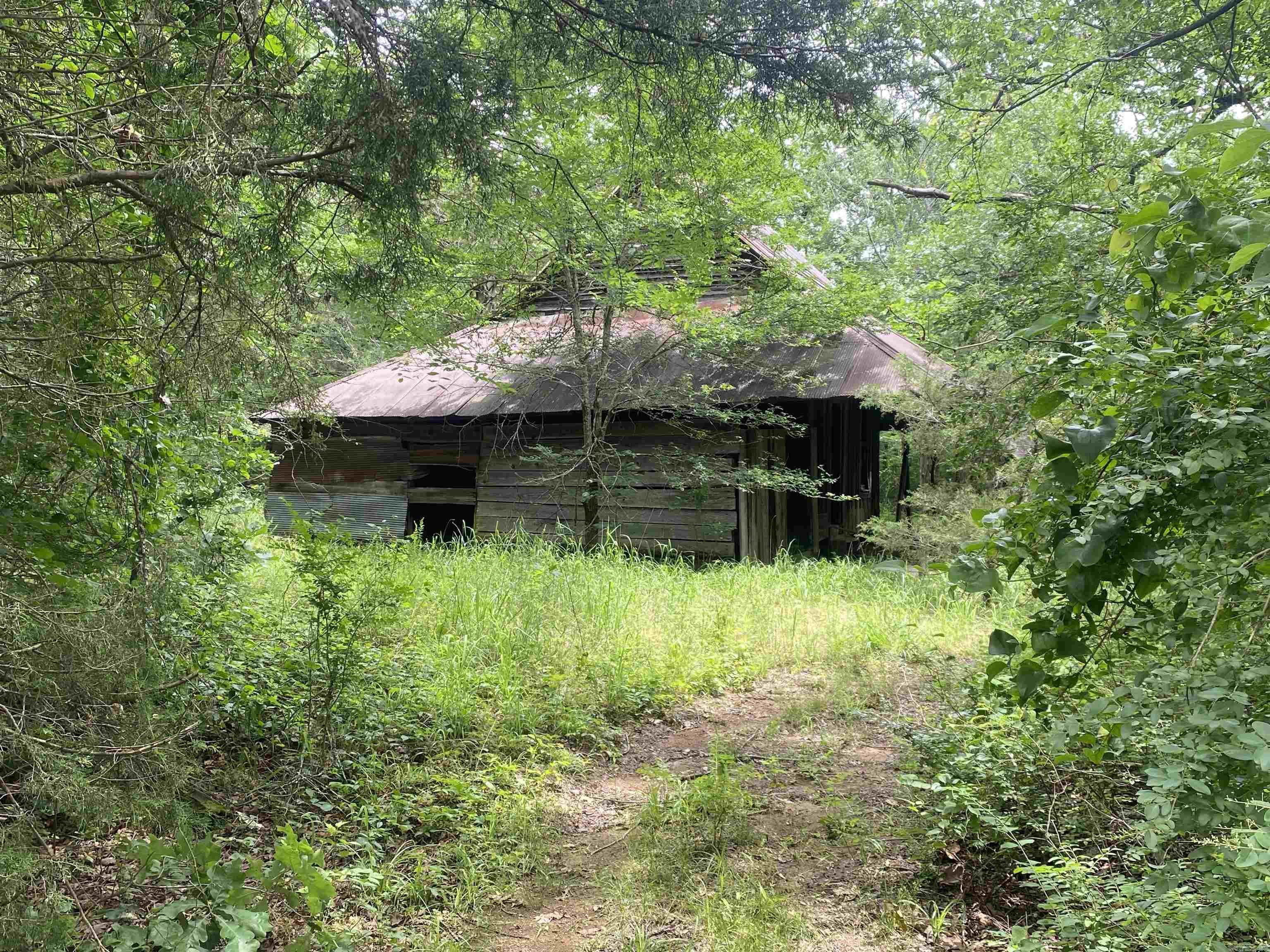 Acreage available! Potential for owner financing with 50% down! Build a cabin or home on this 8 acres m/l parcel in the Pencil Bluff/Sims community! Large, undisturbed trees of all kinds! A nice road has been added to access the property which features a great building site. This property is across Stevenson Road from several hundred acres of Ouachita National Forest and not far from the Ouachita River. Property features an older barn structure and small pond with a wet weather creek. Call today! $66,400.00