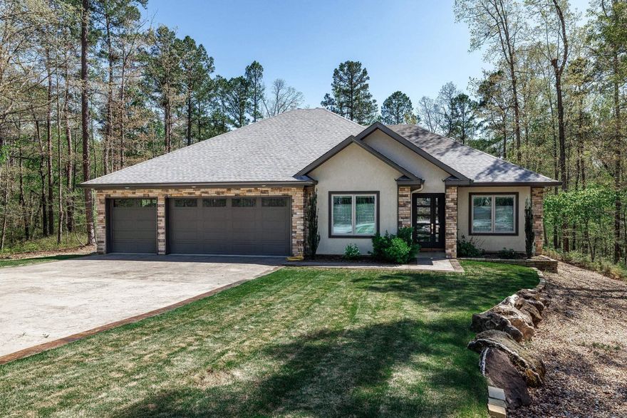 Your own private retreat, but not remote as you are conveniently located mid Village. Choose to entertain either inside or outside in this custom home. Kitchen is open to the dining & living room featuring a stacked stone linear propane fireplace. Open the barn doors to a game room with a custom built bar that includes a fridge & ice maker. Sound system with at blue tooth Onkio receiver, JBL250TI speakers & outdoor PS speakers. Choose to play video games. cards, table games or shoot pool in this spacious game room. Generous primary suite featuring tile walk in shower, soaking tub, double vanity, water closet & large walk in closet that opens conveniently to laundry room. The 2 guest bedrooms & oversized guest bath with walk in shower are separate from primary. Take the party outside & enjoy the salt water pool with an upgraded pool liner that is heated with its own heat pump. Lounge pool side or under the pergola. Oversized covered patio for watching the games outside or enjoy dining outside. Generous three car insulated garage & garage doors with epoxy floors, utility sink and additional shelves in garage Raised garden beds out back. Wrought iron fence. Stamped Concrete. Agnt rmks