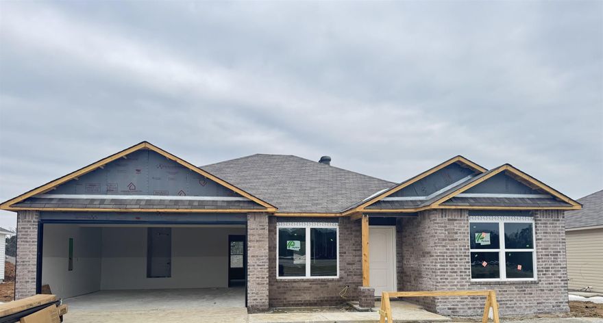 Discover the captivating Carnegie II plan, distinguished by its inviting covered entryway and beautifully landscaped front yard that exudes curb appeal. This thoughtfully designed home encompasses 4 bedrooms and 2 bathrooms, providing ample space for comfort and privacy. The spacious living room offers a welcoming environment for relaxation and gatherings. The kitchen is a chef's delight, equipped with energy-efficient appliances, abundant counterspace, and a convenient pantry for storage. The adjacent laundry room, situated just off the garage, ensures practicality for families of any size. The master suite includes a luxurious walk-in closet, enhancing the home's appeal and functionality. Explore more about this remarkable home today!   **SEE SHOWING REMARKS & AGENT REMARKS FOR IMPORTANT INFORMATION**