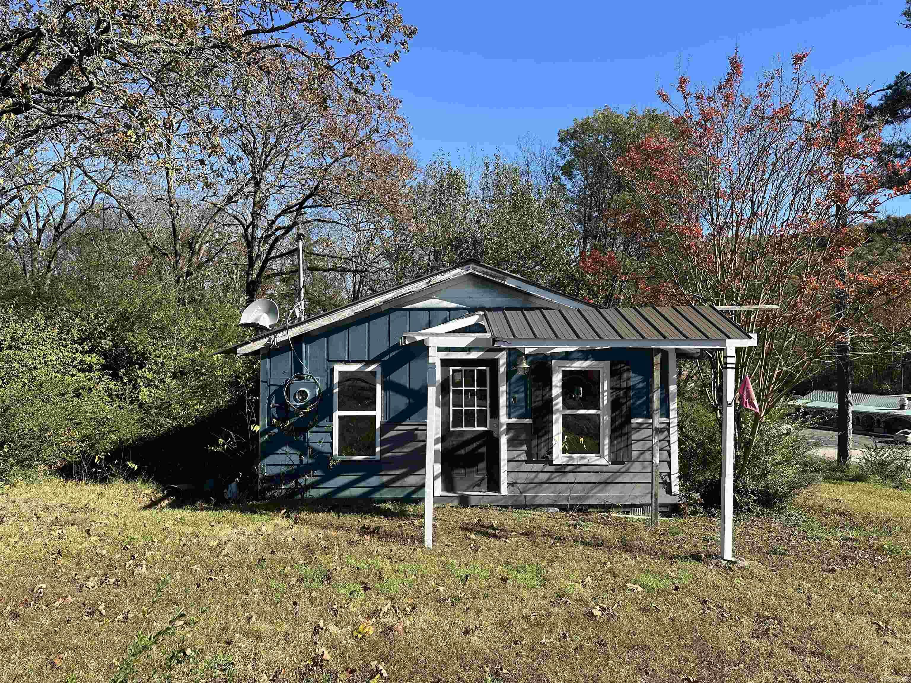 House is a fixer. The living room and kitchen has new tong and grove with some ceiling beams. The back bedroom has some nice crown molding and new sheetrock. It has some new windows and new sunroom doors off the back bedroom. House need work. Sold as.