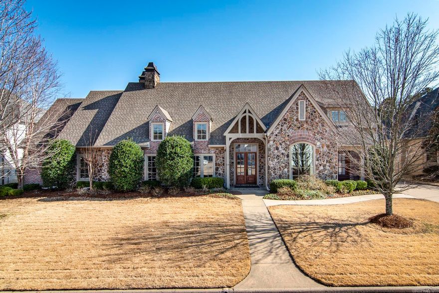Impeccably maintained executive home in prestigious Chenal Valley gated neighborhood. This home has the finest of finishes with heart of pine and brick floors, vaulted ceilings, beautiful moldings, 8 ft. doors, and slab granite countertops. The open floorplan offers a great place for family living as well as entertaining. The light filled sunroom overlooks the inviting heated and cooled swimming pool and waterfall. There are 4 fireplaces, one woodburning in the sunroom and 3 others..one in primary suite, greatroom and hearth room. The chef's kitchen has top of the line appliances, built-in refrigerator and copper vent over gas cooktop. There is a butler's pantry and walk in pantry easily accessible to the Formal dining room. There are 3 bedrooms on the main level and 2 bedrooms (one could be an office) and fully equipped media room with projection tv and screen upstairs. Additional amenities include a saferoom, 3 tankless HWH, security camera system, whole house generator and much more.