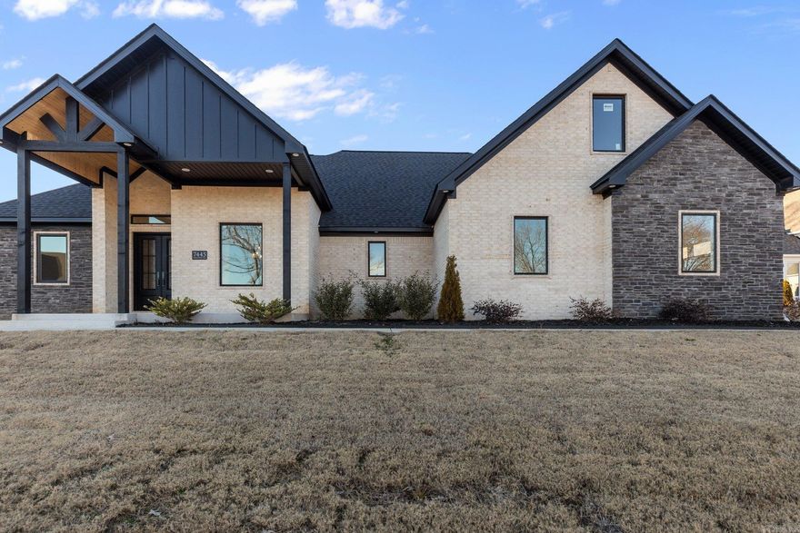 Discover your dream home in this exquisite 4 bedroom, 3 bathroom residence nestled on a generous 1/3 acre lot with breathtaking lake views. This property blends elegant design, featuring a spacious open floor plan with luxury vinyl flooring throughout. The living room boasts 12 ft ceilings, a cozy gas fireplace, a formal dining room, and a tv that conveys with property. The heart of the home is a stunning kitchen equipped with a gas range stove, a large island with a breakfast bar, a dining area, and a walk-in pantry. The luxurious primary suite features vaulted ceilings, an en-suite bathroom with a custom tile shower, double vanities, and a master closet with built-in dressers. A bonus room upstairs offers flexible space, and the laundry room includes a practical mud area. The home’s exterior combines brick and stone for timeless appeal, and the fully fenced backyard with a sprinkler system ensures privacy and easy maintenance. Located in a gated community, this home offers peaceful living with convenient access to many amenities.