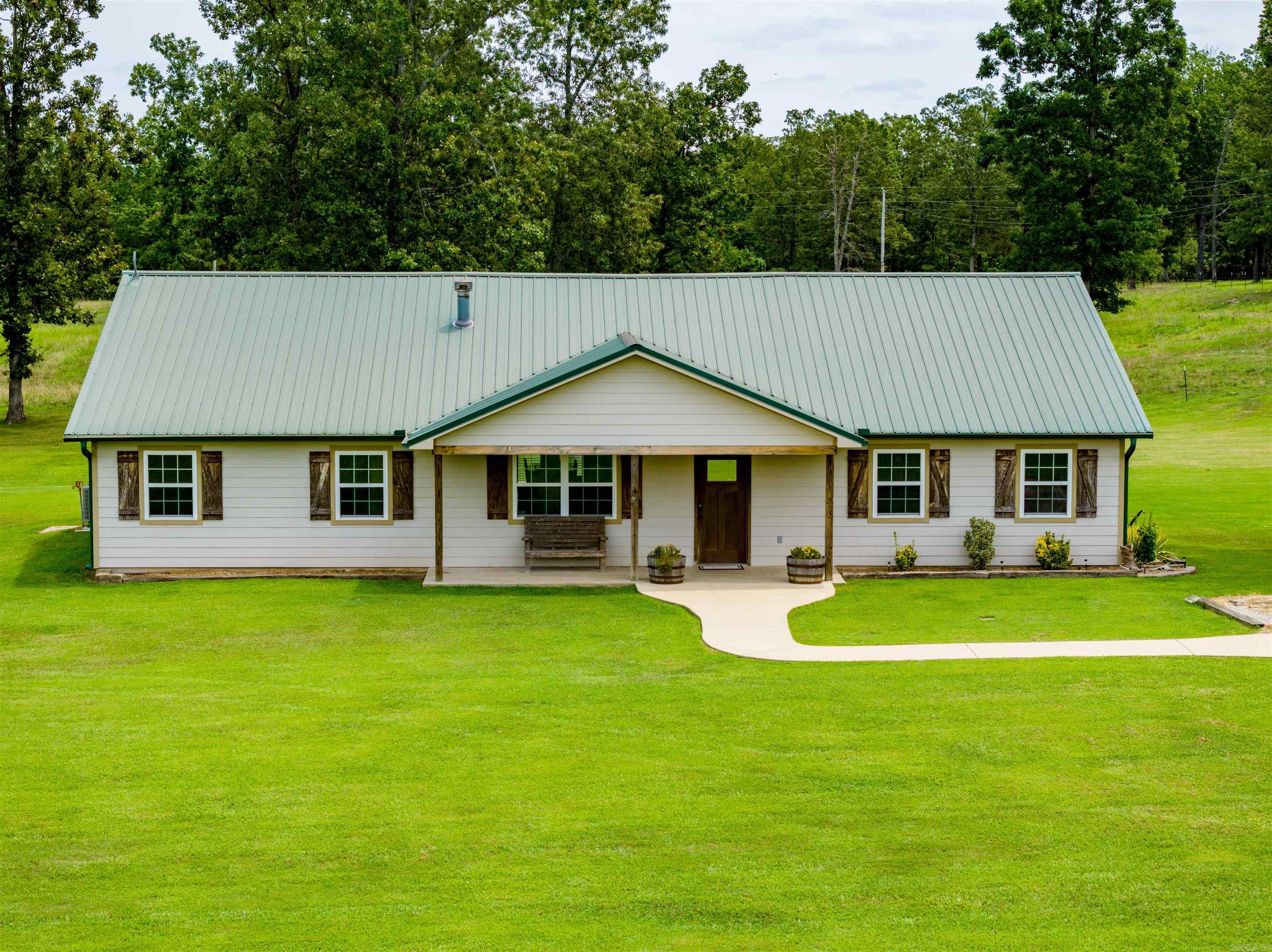 165 +/- Acre Cattle Ranch!This ranch is a very well-manicured farm with about 80 acres of pastureland, some of which are used as hayfields, and the remaining acres are made up of a mixture of hardwoods.Woods have a firebreak around them.The property is fenced, cross-fenced, with two ponds, a 30 by 36, 5 stall barn with a feed room and a rollup door, multiple working coral setups, and every field has a freeze-proof water tank with a shutoff valve.This makes working cattle and managing cattle run smoothly. Fields have been fertilized and sprayed yearly with trails throughout the farm so that you can drive anywhere on the farm at any time of the year!When you enter the gate off the main road, you will return to the house, where you sit off the road looking over the gorgeous pasture and a pond!You will see the house and the shop.This home was built by the seller in 2012 and has a metal roof, concrete board for siding, gutters, stone countertops, Next (FIBER Internet), NAEC Electric, and a Well for water!With 5 bedrooms, 2 full baths, a large living room, laundry room, dining room, and that nice open kitchen with a eat at bar, two porches, and views!Guest house,1 bed 1 bath, with shop.