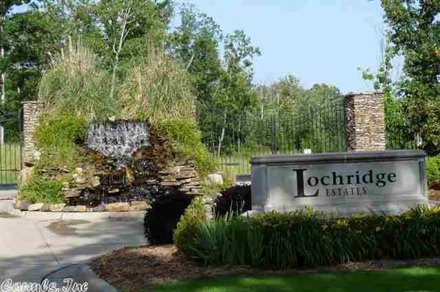 This is a really nice flat Lake Front Lot on Lake Florence (with just enough fall to have storage below if you like) with one of the most serene views in a wonderful gated neighborhood. As you enter through the manicured gated entrance with waterfall, There are gentle rolling hills but the overall area is fairly flat. You will appreciate the peace & quiet yet advantageous location with quick access to the Interstate 430 from Colonel Glen or Lawson Road. Just 8 Lake Lots are left to build on.