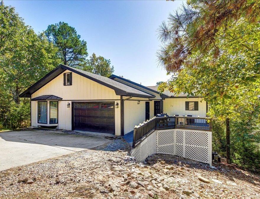 SPECTACULAR MOUNTAIN VIEW Home with Modern Upgrades!  This home in the picturesque Hot Springs Village is perfectly situated near scenic golf courses and tranquil lakes. The beautifully updated 4-bedroom, 3-bath residence boasts breathtaking mountain views, best enjoyed from the newly constructed deck.  Step inside to find a recently updated kitchen equipped with modern amenities, offering an ideal space for hosting dinner parties and family gatherings. The home's fresh interior and exterior paint create a bright and inviting ambiance, while the durability of a 5-year-old roof ensures lasting peace of mind.  Experience the perfect blend of natural beauty and contemporary comfort in this charming home, surrounded by the serene landscapes of Hot Springs Village and only minutes to shopping and restaurants. With ample space for comfortable living, this property is a true retreat for those seeking both relaxation and style. Take the opportunity to make this tranquil escape your own!   SELLER NOW OFFERING $2,000 CONCESSION TO BUYER AT CLOSING FOR THE VILLAGE BUY IN FEE WITH ACCEPTABLE OFFER!  COME AND SEE!!   Agents - Call Showing service to schedule all showings.
