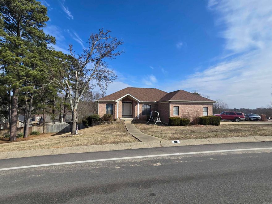 3 bedrooms and 2 bathrooms and a living room, formal dining room, kitchen and breakfast area on main level.  Downstairs has 2 large entertainment rooms with a wet bar along with a 3rd bathroom and an office.  The downstairs could be an in-law quarters.  Some areas freshly painted inside, newer flooring in most of the house.  Replaced primary shower wall.  New windows about 2 years ago, new water line, new roof in 2023.  Double deck on a corner lot.  Love the space.  Will not last long.