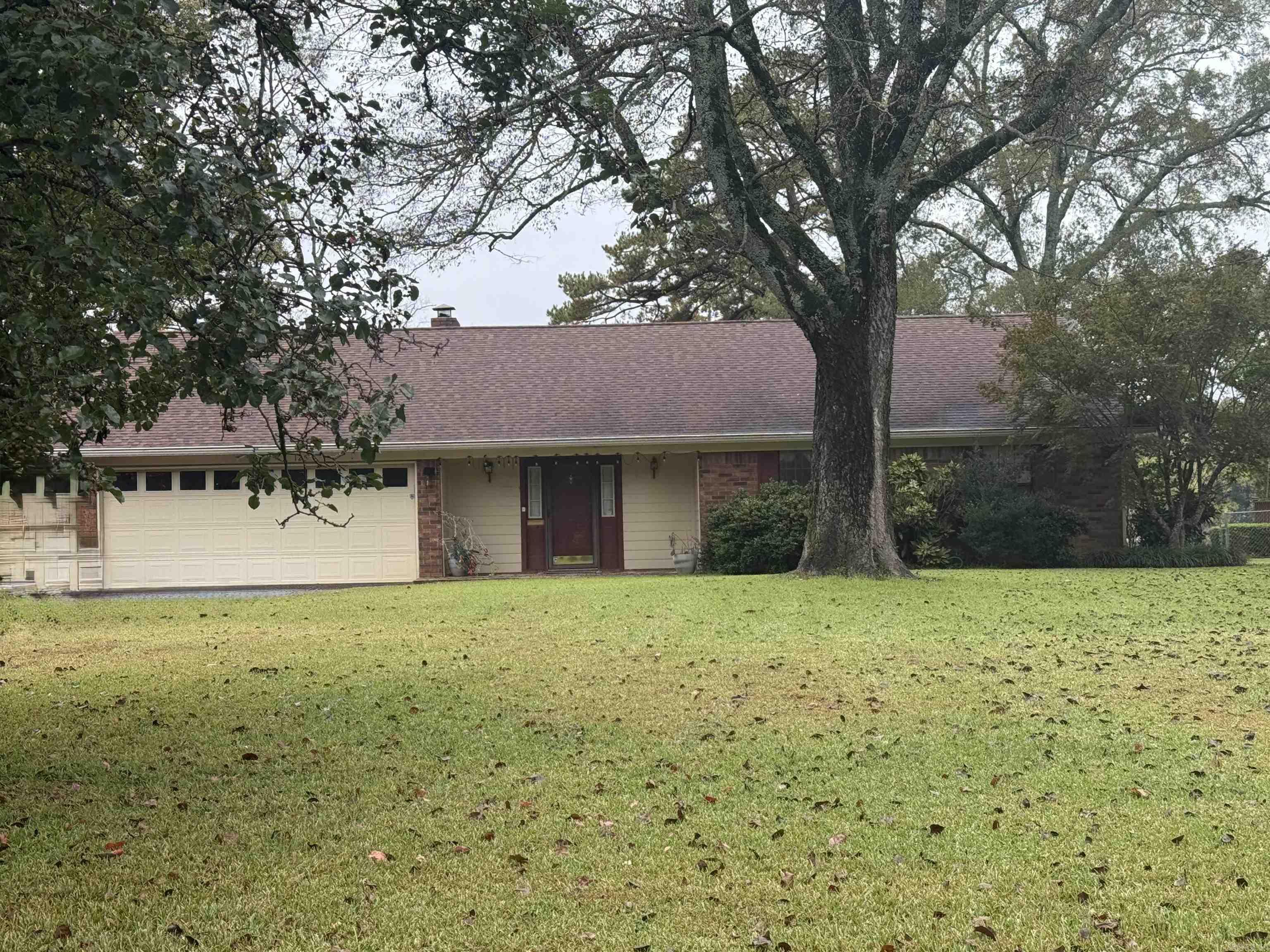 Welcome to your serene lakefront retreat in the prestigious Caroline Acres subdivision. This brick ranch home offers the ultimate in convenience and recreation. Perfect for boaters, lake lovers and anyone wanting the lake lifestyle with beautiful views with 100 feet of lake frontage and only minutes from shopping, dining and marinas. All on one level allowing for smooth barrier free living and easy accessibility. Step into a bright and open great room anchored with a fireplace and windows that frame the lake view. Enjoy direct lake access with a covered boat dock (new roof) and swim dock where you can relax, swim or just enjoy the sunset. An outdoor storage building offers a space for your tools, yard gear or lake toys. Long paved drive with extra covered parking to facilitate boat trailers or guests.