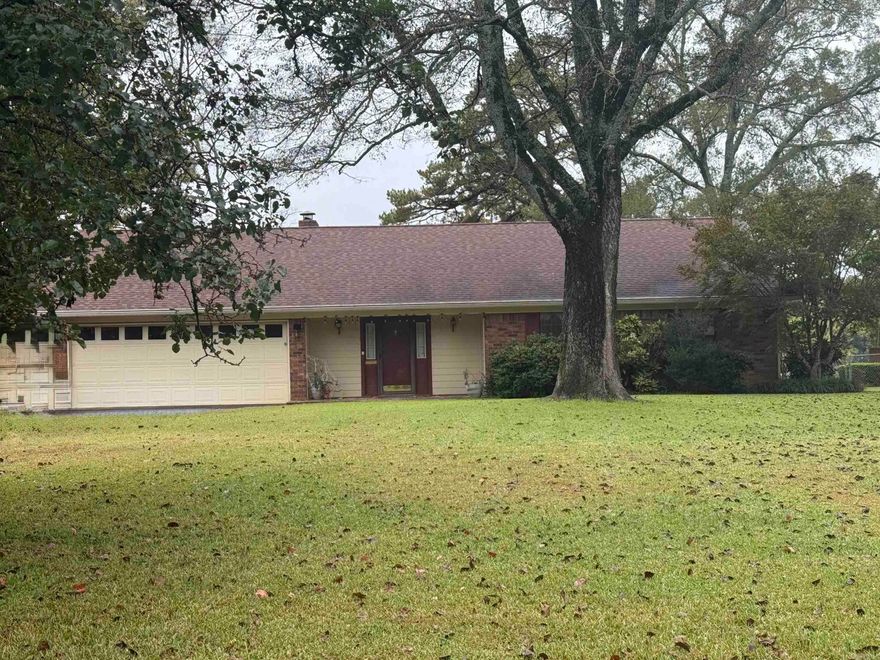 Welcome to your serene lakefront retreat in the prestigious Caroline Acres subdivision. This brick ranch home offers the ultimate in convenience and recreation. Perfect for boaters, lake lovers and anyone wanting the lake lifestyle with beautiful views with 100 feet of lake frontage and only minutes from shopping, dining and marinas. All on one level allowing for smooth barrier free living and easy accessibility. Step into a bright and open great room anchored with a fireplace and windows that frame the lake view. Enjoy direct lake access with a covered boat dock (new roof) and swim dock where you can relax, swim or just enjoy the sunset. An outdoor storage building offers a space for your tools, yard gear or lake toys. Long paved drive with extra covered parking to facilitate boat trailers or guests.