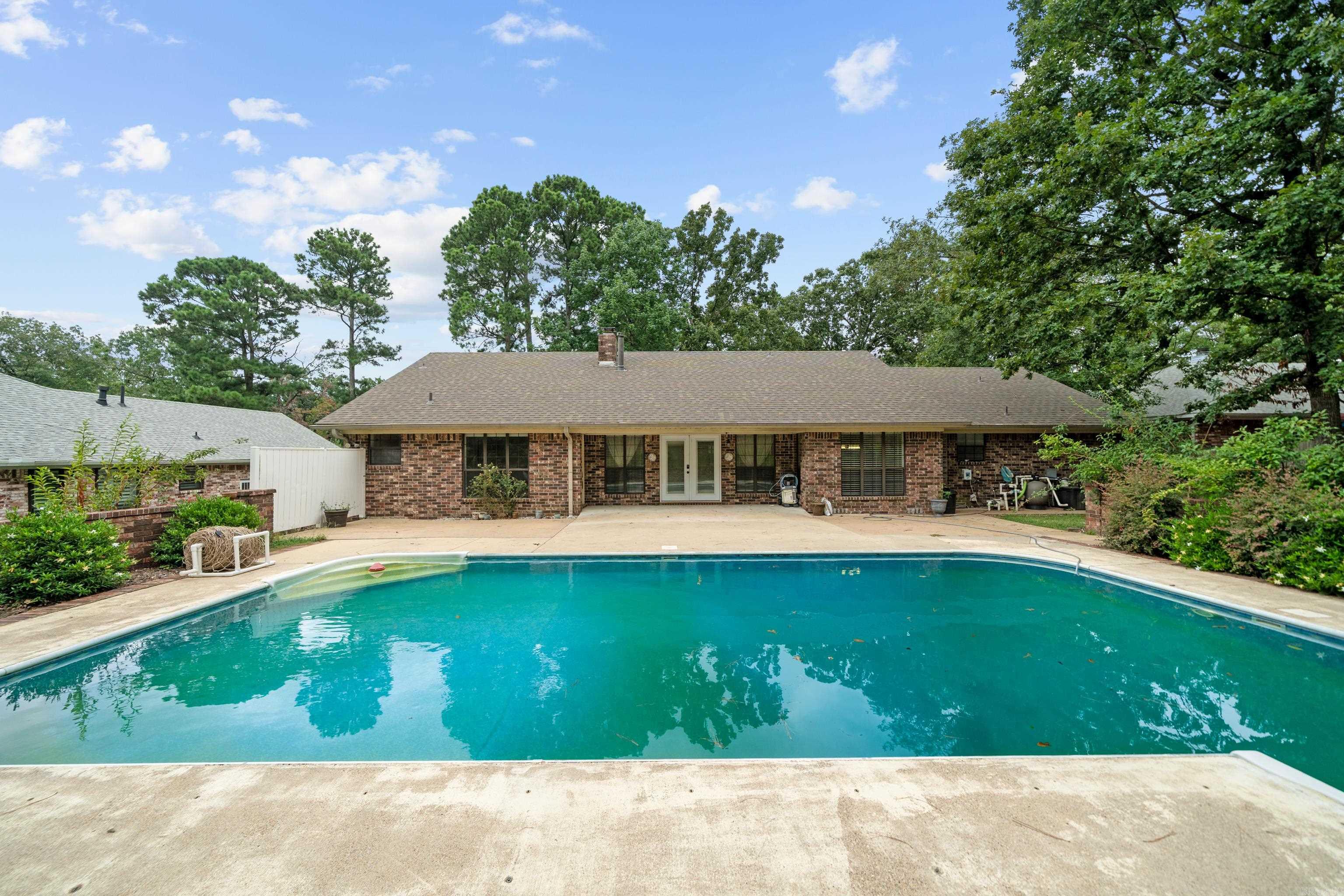 Your Summer Oasis Awaits! DONāT MISS OUT on the fun this beautifully remodeled home has to offer! With 3 spacious bedrooms, 2 stylish bathrooms, and walk-in closets throughout, this home is designed for both comfort and entertaining. The vaulted ceiling in the living room creates an open, airy feel that flows seamlessly to the patio and sparkling saltwater pool ā your own private backyard retreat! The custom-designed primary bathroom is a true showstopper, and the kitchen and bathrooms feature brand-new granite countertops. Enjoy morning coffee or host guests with ease using the new French doors that open directly to your poolside paradise. Additional upgrades include a tankless water heater, whole home generator, and a 2-year-old roof, offering peace of mind for years to come. You'll love the eat-in kitchen, formal dining room, and the convenience of deeded access to beautiful Lake Hamilton just moments away. With great curb appeal, a fenced backyard perfect for kids and pets, and thoughtful touches throughout, this home truly has it all. Schedule your private showing today and dive into the Lake Hamilton lifestyle!