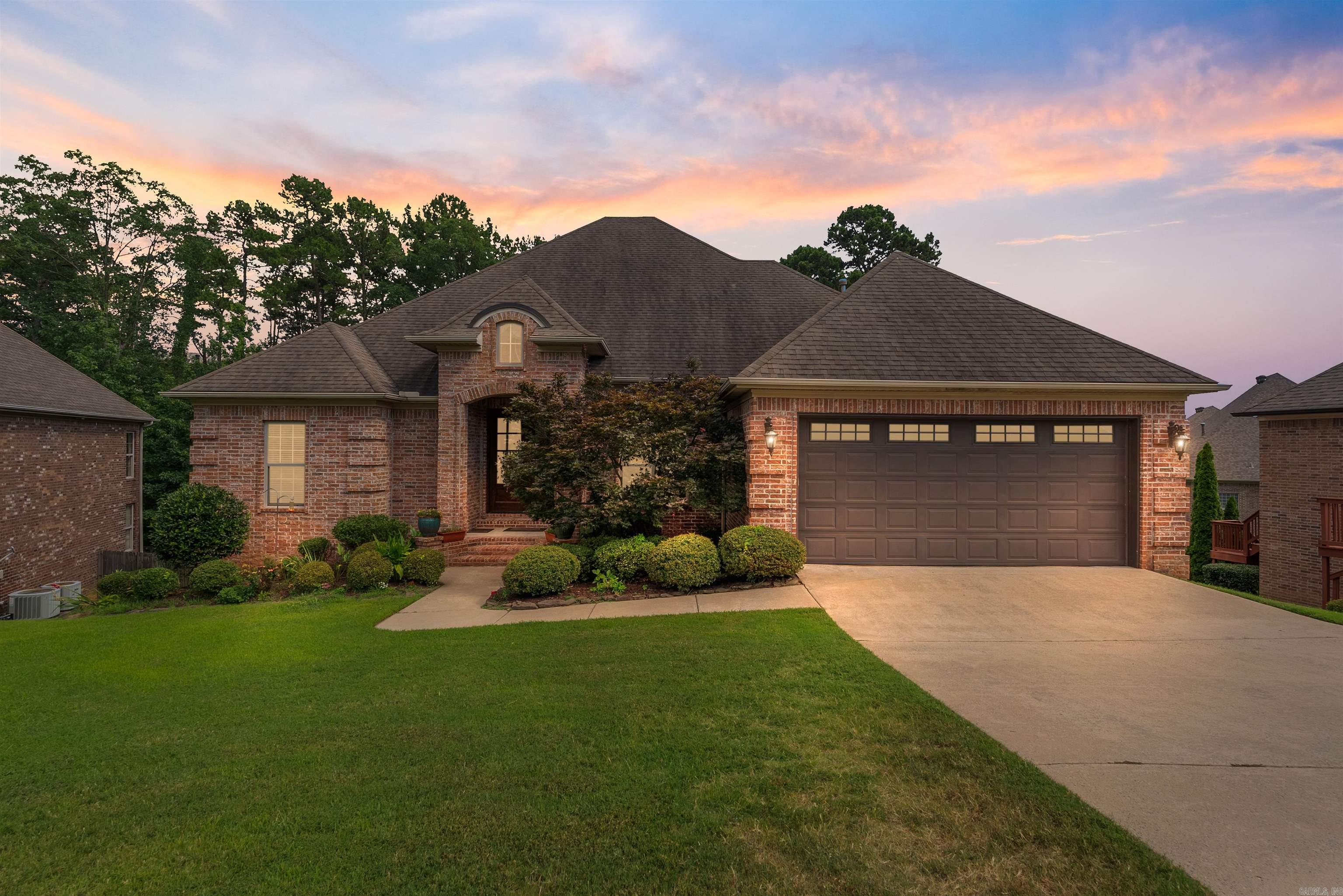 This beautiful home is located in the desirable Villages of Wellington within walking distance to the neighborhood pool, playground, tennis/pickle ball courts! Inside discover freshly refinished oak hardwood floors, new interior paint, new LED lighting & an incredible light-filled floor plan. Beautiful wooden front doors welcome you to the entryway w/ tall ceilings open to the formal dining room adjacent to the office and half bathroom. The great room overlooks the backyard, framed by arched openings w/ direct access to the covered deck and backyard. The kitchen features granite countertops, a prep island, breakfast bar w/ barstool seating, gas cooktop and new refrigerator, oven, dishwasher, and microwave. The hearth room features a gas fireplace and charming breakfast area. The main-level primary suite offers a spacious bathroom with double vanities, jetted tub, shower, water closet & walk-in closet. Two additional guest bedrooms share a hall bath on the main level, allowing this home to function as a one-level home. Downstairs are 2 guest bedrooms, a hall bath & a large game room with access to the lower deck that overlooks dedicated green space.