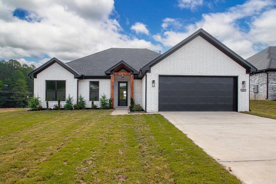 This beautiful new construction home features 4 bedrooms, 2 bathrooms, and stylish custom finishes throughout. Enjoy an open layout with a cozy brick fireplace, a spacious kitchen, and a generous laundry room. The primary suite offers a relaxing retreat with a well-appointed bath and walk-in closet. Situated on a flat lot, the home also includes a covered back patio—perfect for outdoor living.