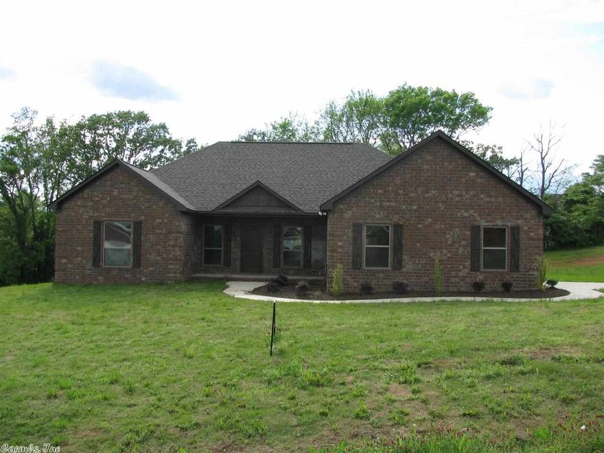 This new construction home features solid granite countertops in kitchen, custom cabinetry, hand - scraped hardwood flooring in living, tile in all wet areas, low E windows, solar shield decking, blown fiber insulation, and much more.  A must see to appreciate.  Price change is reflection of custom outdoor rock fireplace being installed.  Home is move in ready.