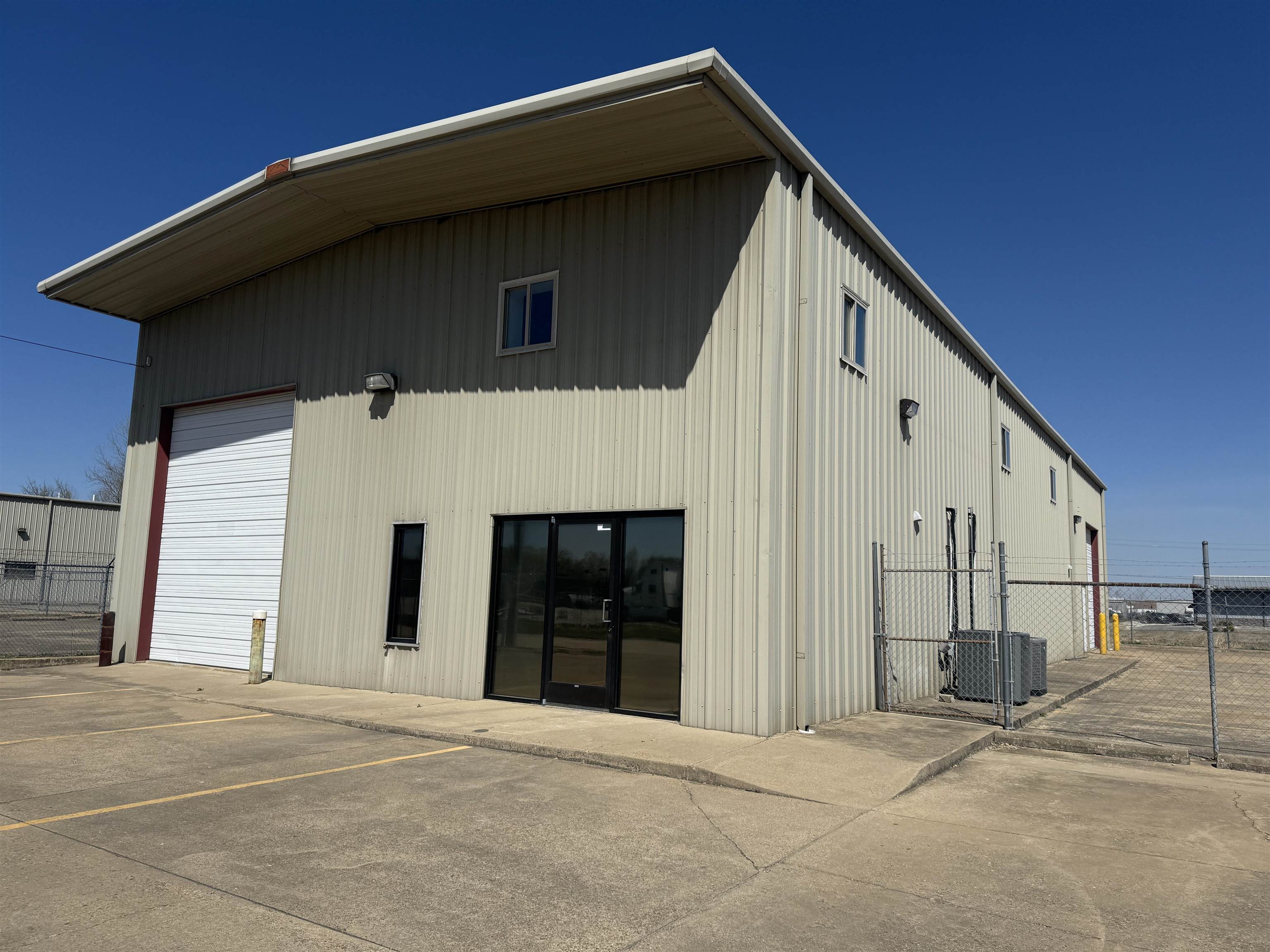 Warehouse and Office Space For Lease! Suitable for many types of businesses, this property is currently nearing its remodeled phase and should be ready to go within a month. New flooring, cabinets, appliances and more will be installed very soon! Roughly 2500 square feet of warehouse and 2500 square feet of office space included. Fenced in area for parking is perfect for company vehicles and equipment. There are (2) 16' roll up doors with operators. First level contains 3 offices, break room, kitchen, bathroom, waiting area, open area for more offices or conference room. Second level features 2 offices, conference room, open area for more offices, access to storage area, bathroom with a shower.